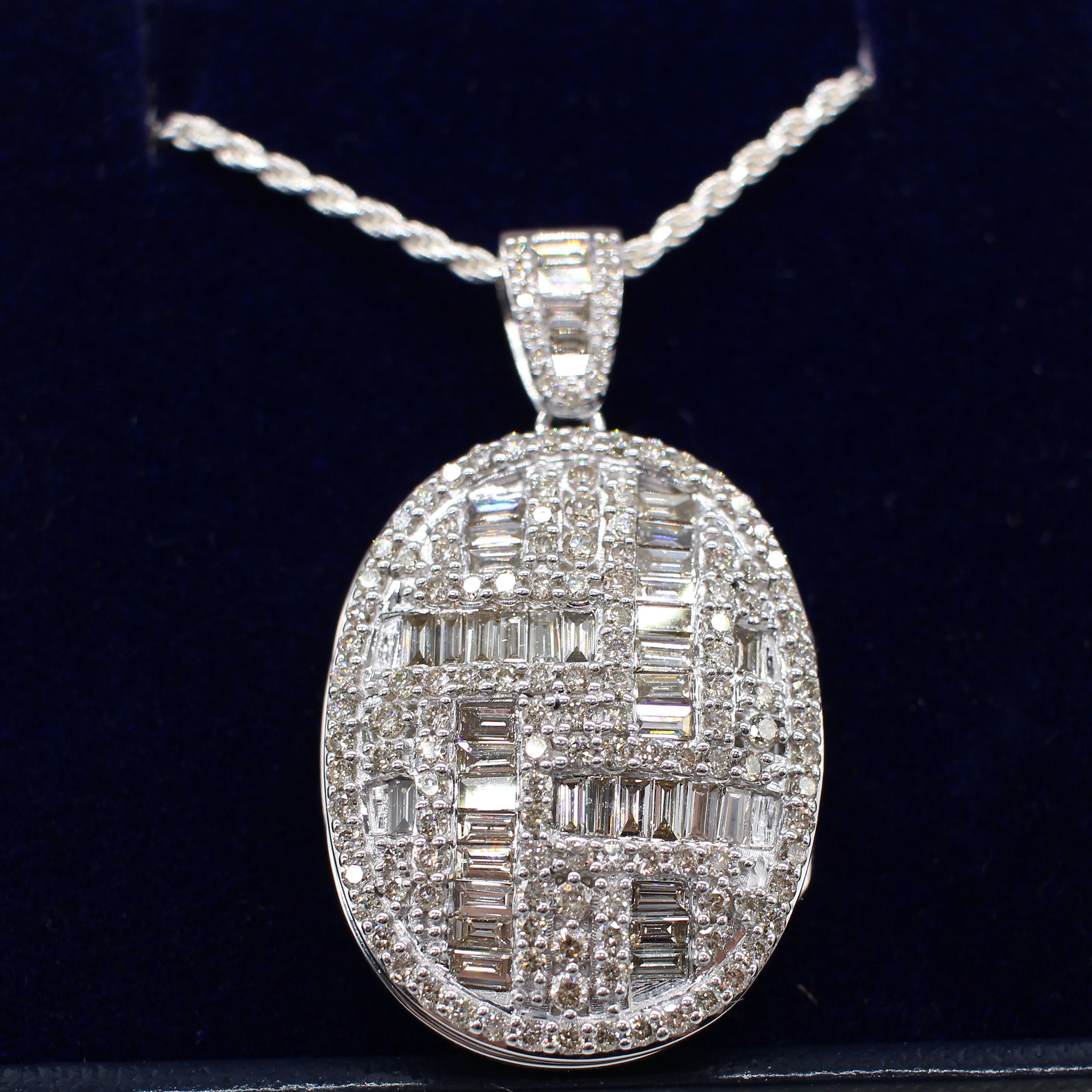 2.18CT DIAMOND ENCRUSTED WHITE GOLD LOCKET.