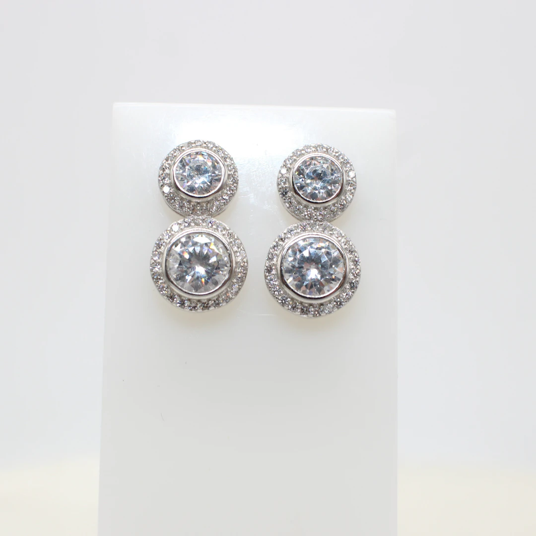 SILVER DUAL SOLITAIRE STUDS.