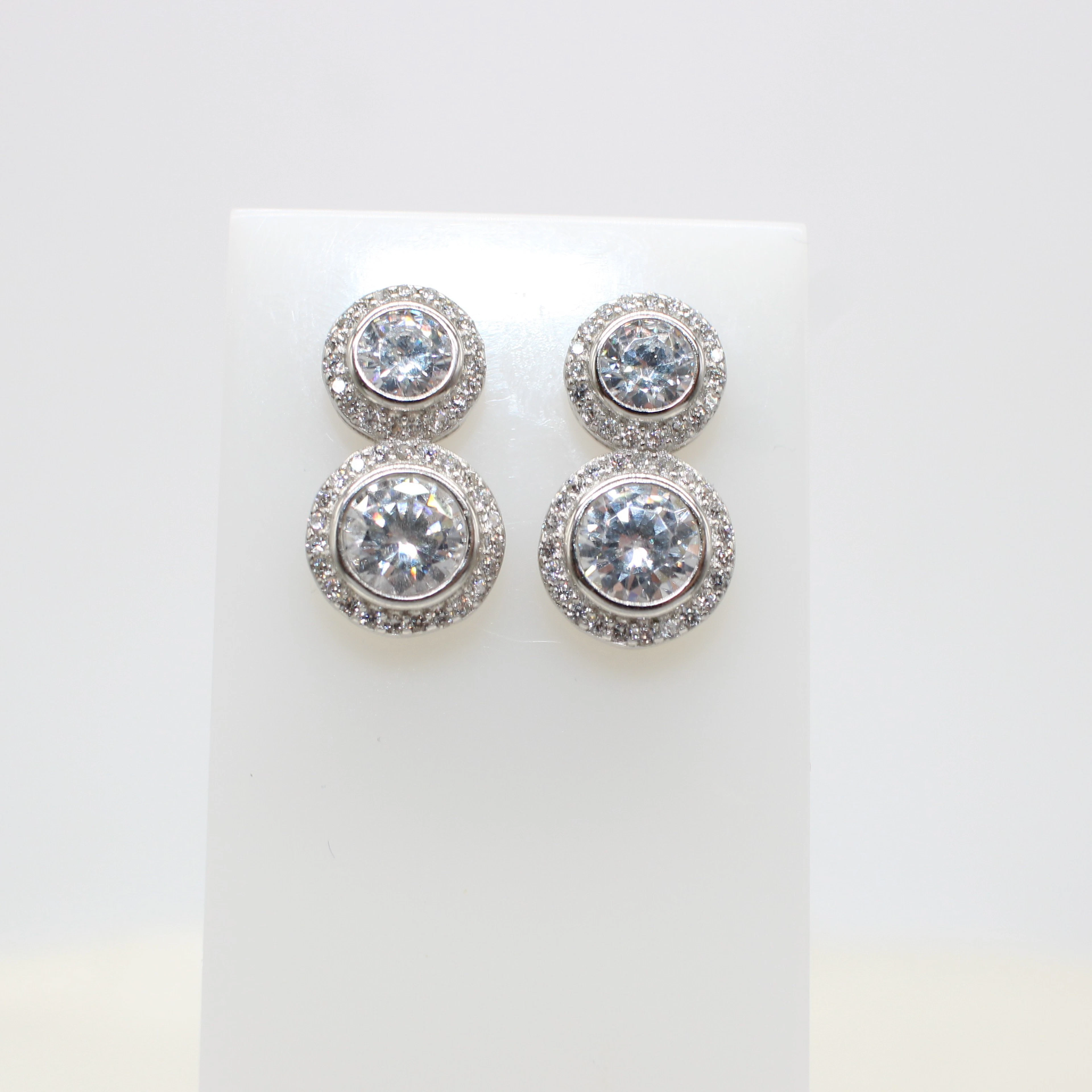 SILVER DUAL SOLITAIRE STUDS.