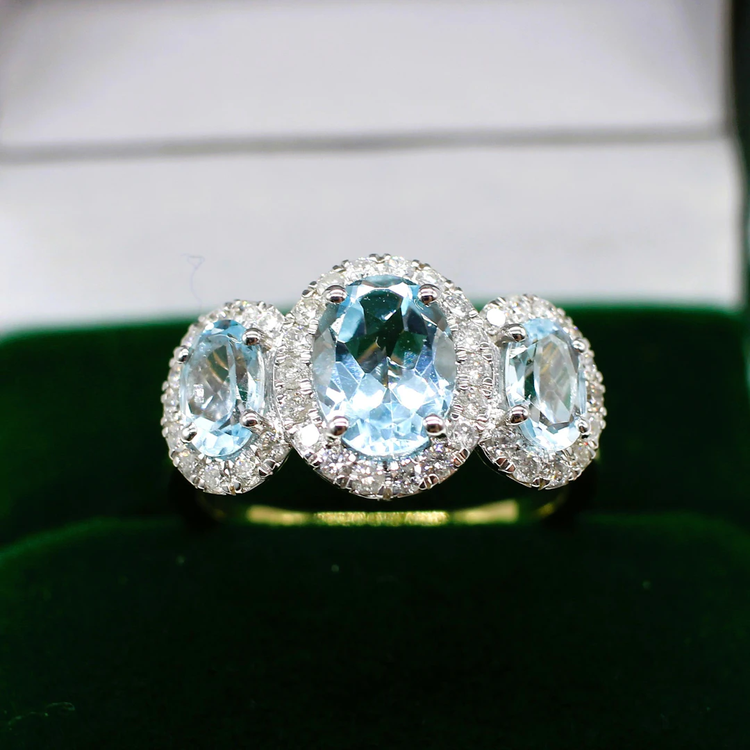 TOPAZ & DIAMOND TRILOGY HALO RING.