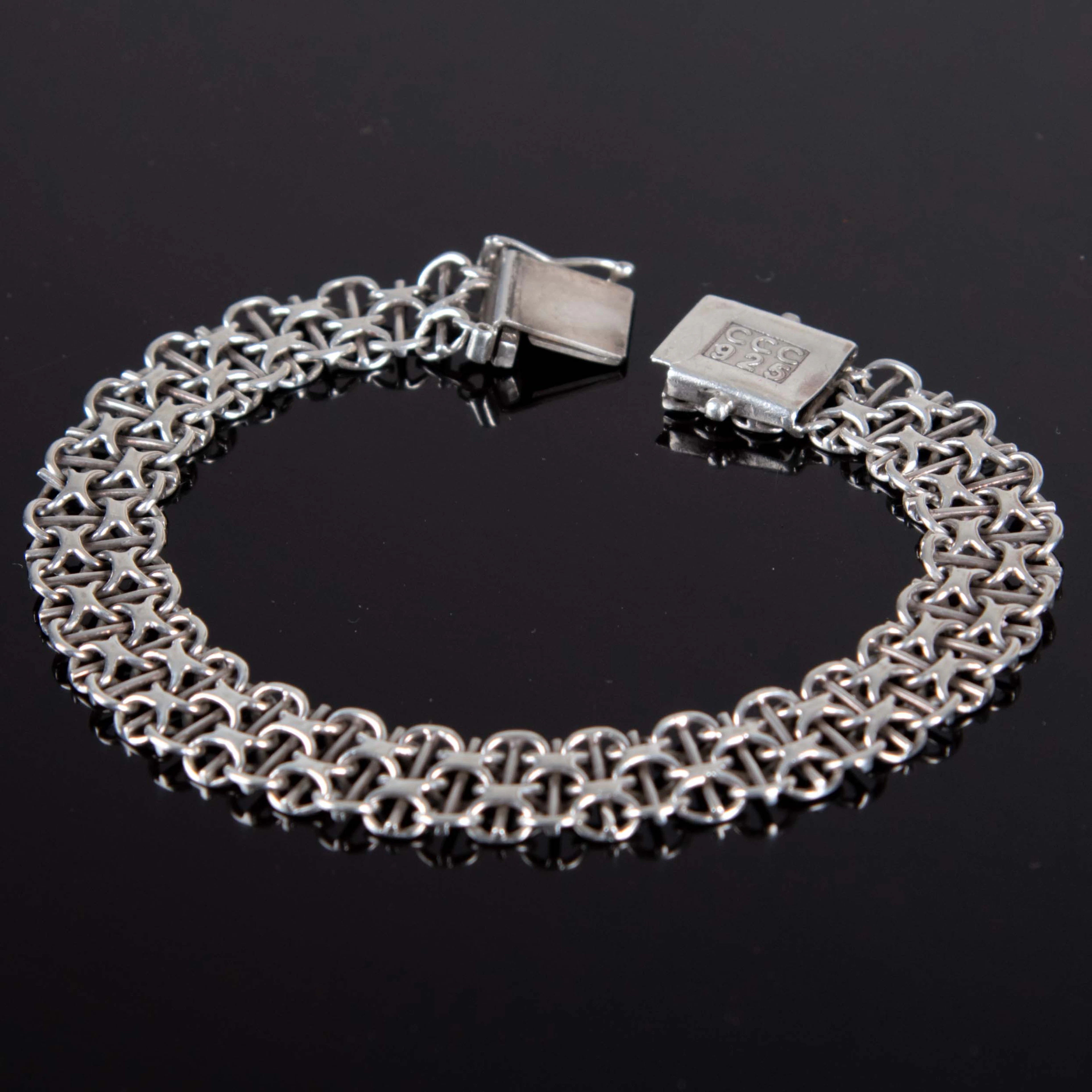 ARMBAND. X-länk, silver.
