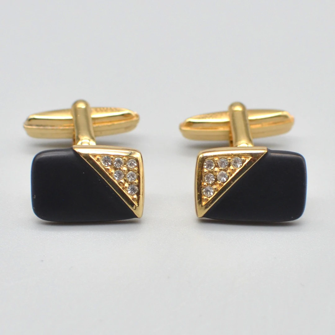 CHRISTIAN DIOR. DESIGNER-MANSCHETTENKNÖPFE, ONYX, STRASSSTEINE, VERGOLDETE