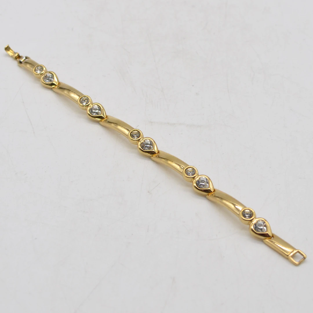 GROSSÉ, VINTAGE MODESCHMUCK, VERGOLDETES GLIEDERARMBAND MIT STRASSSTEINEN
