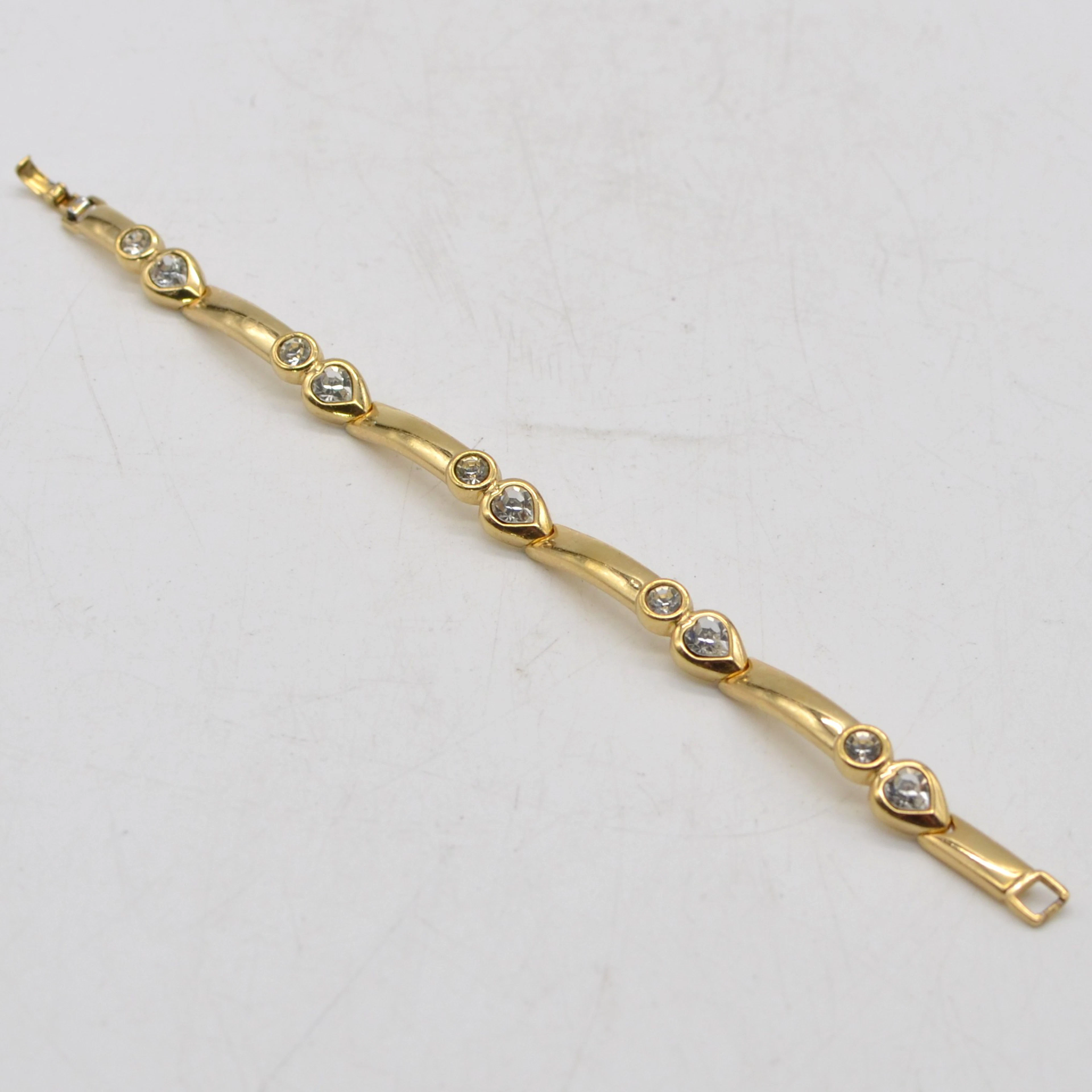 GROSSÉ, VINTAGE MODESCHMUCK, VERGOLDETES GLIEDERARMBAND MIT STRASSSTEINEN