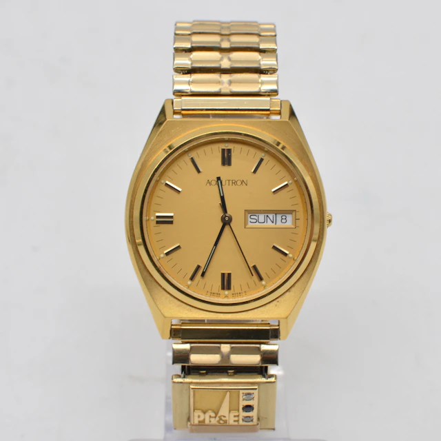BULOVA ACCUTRON (92561), ARMBANDUHR MIT BRILLANT & SAPHIR, PG&E LOGO