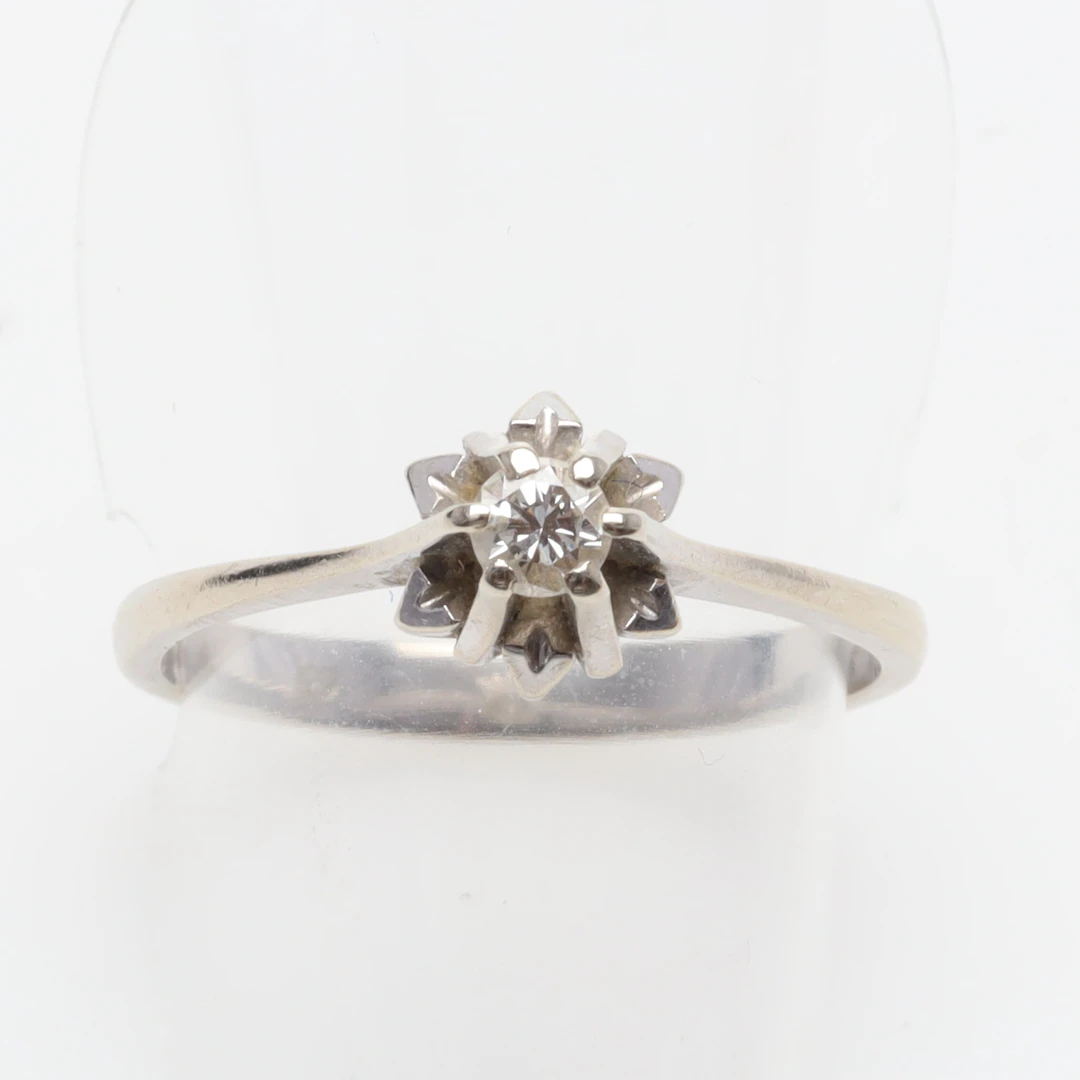 RING 18K vitguld med diamant 1 x ca 0,14ct bruttovikt 2,9 gram.