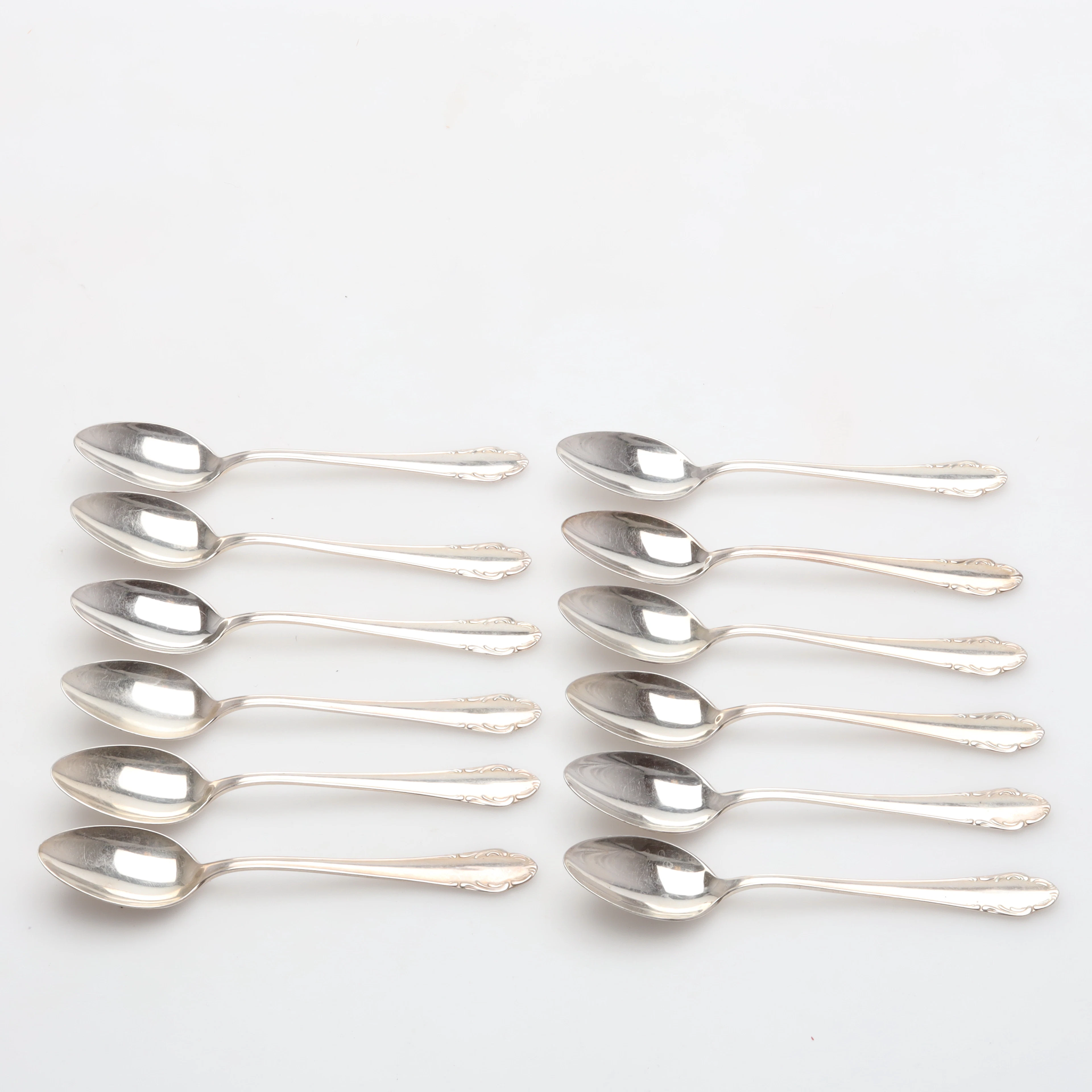 KAFFESKEDAR 12 stycken modell Haga silver vikt ca 197,8 gram.