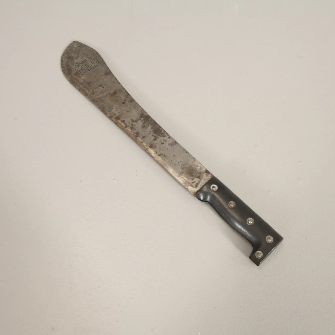 MACHETE bladet märkt 'Bolo Hand Forged'.