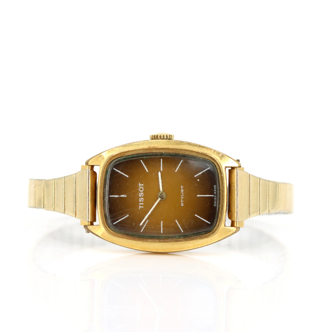 TISSOT. Stylist, armbandsur, guld på stål, manuell, Schweiz, 1970-tal.
