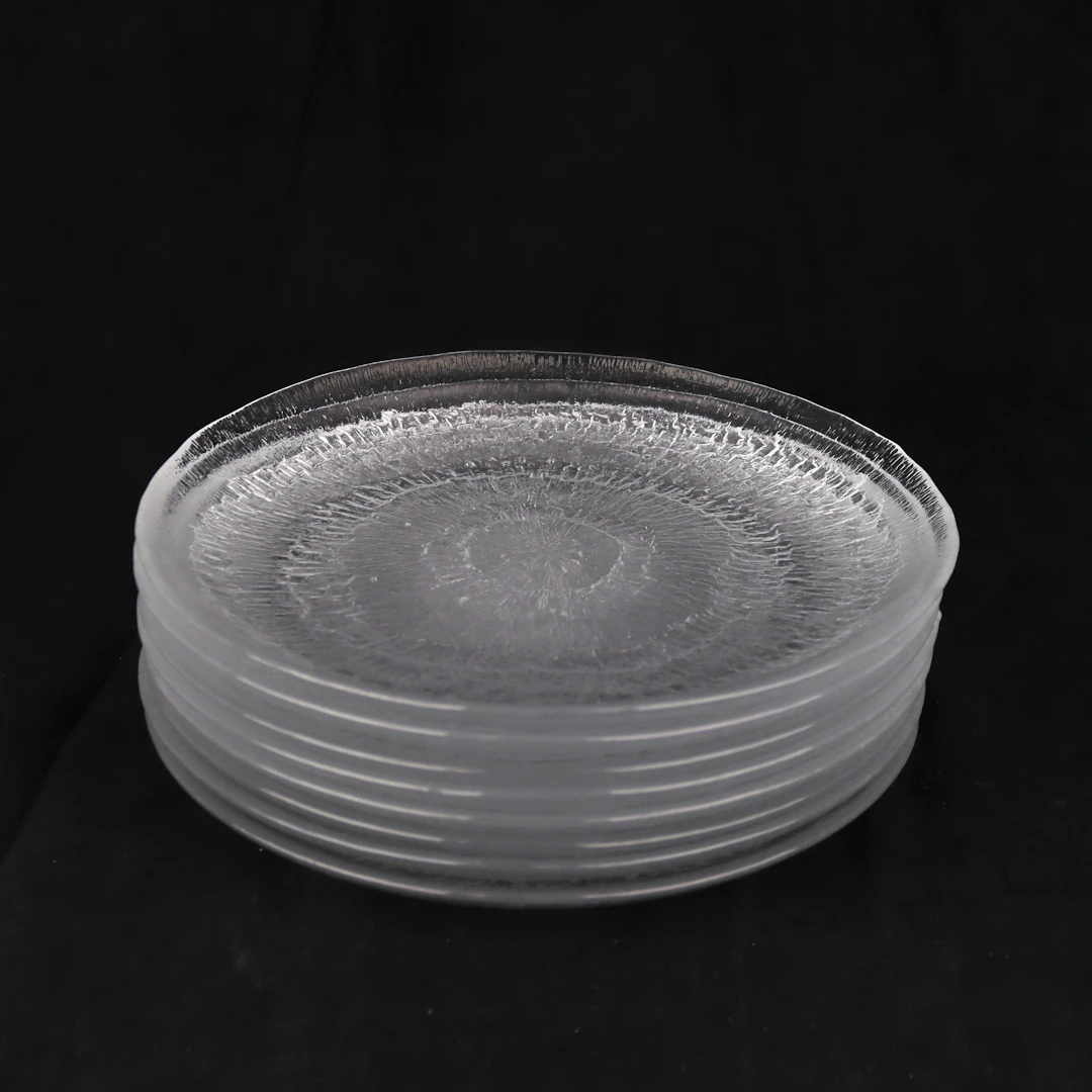 TAPIO WIRKKALA. Assietter, 8 st, "Solaris", glas, Iittala, Finland.