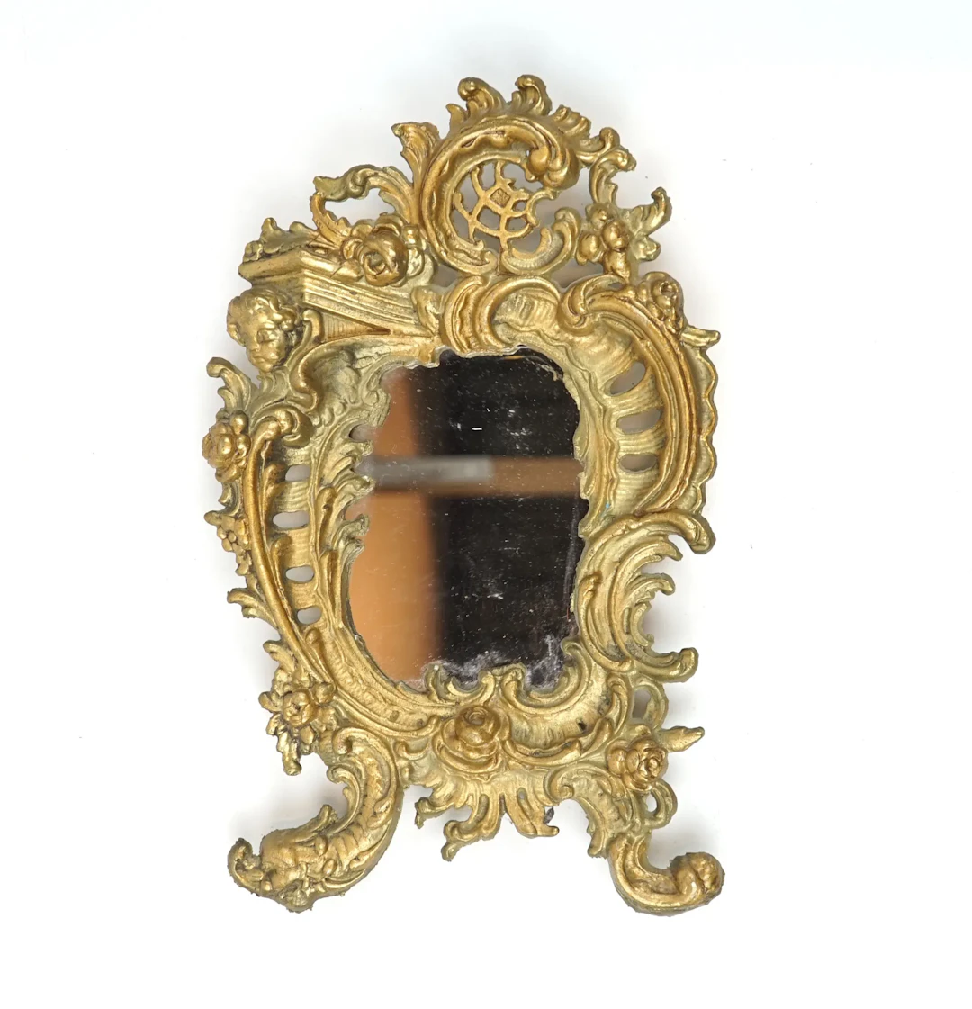 Mirror, gold-plated metal.