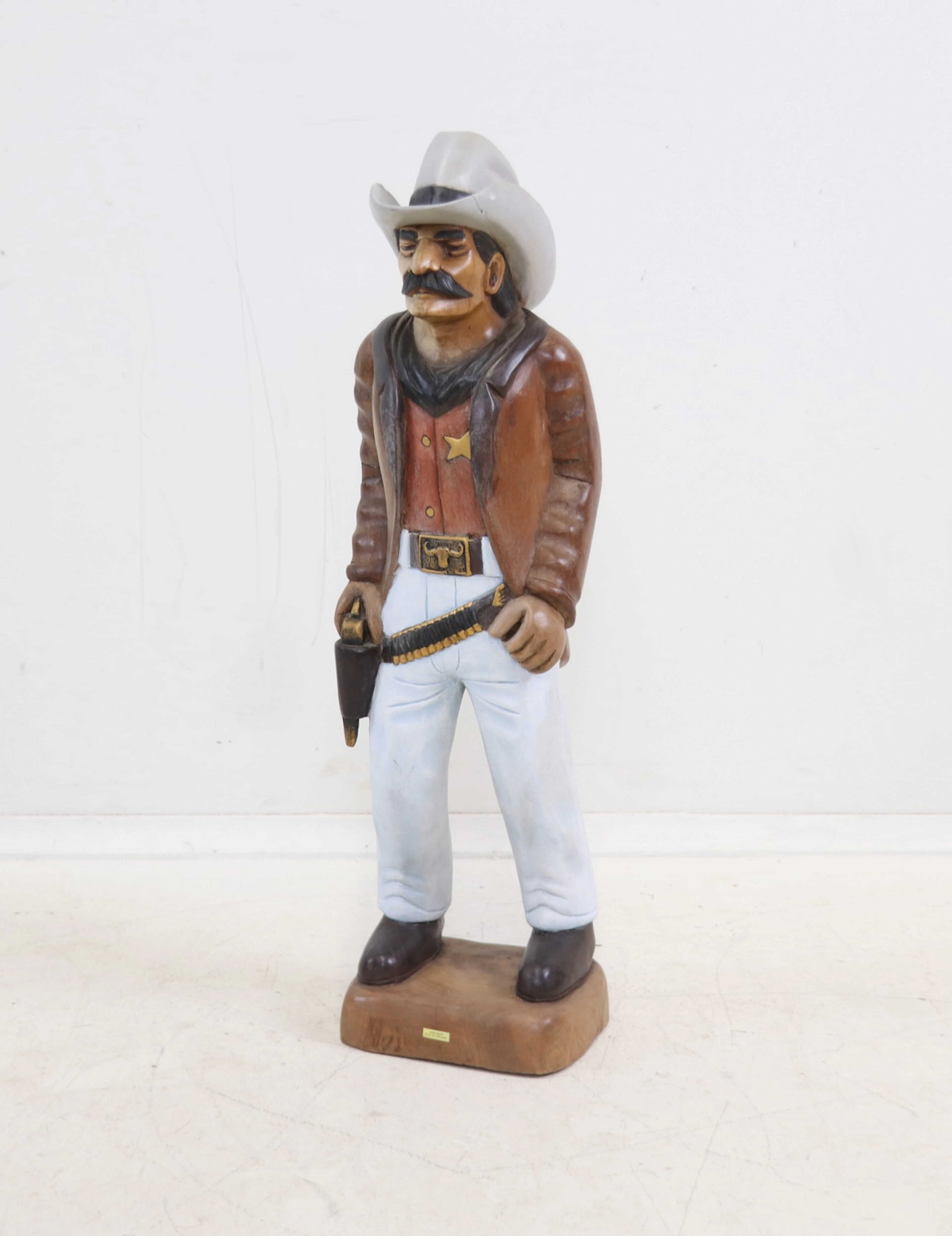 Escultura, vaquero, madera.