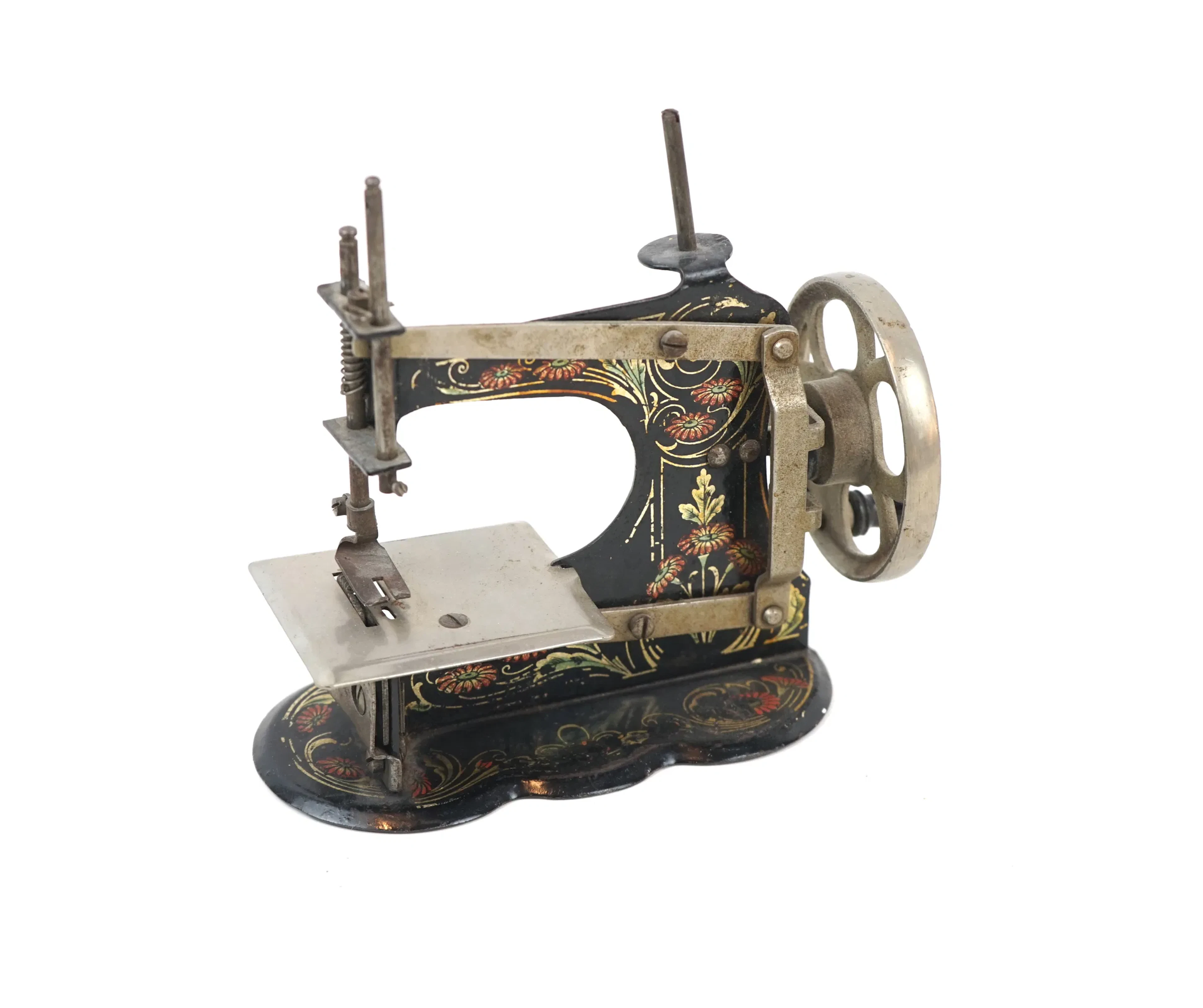 Máquina de coser de juguete, metal.