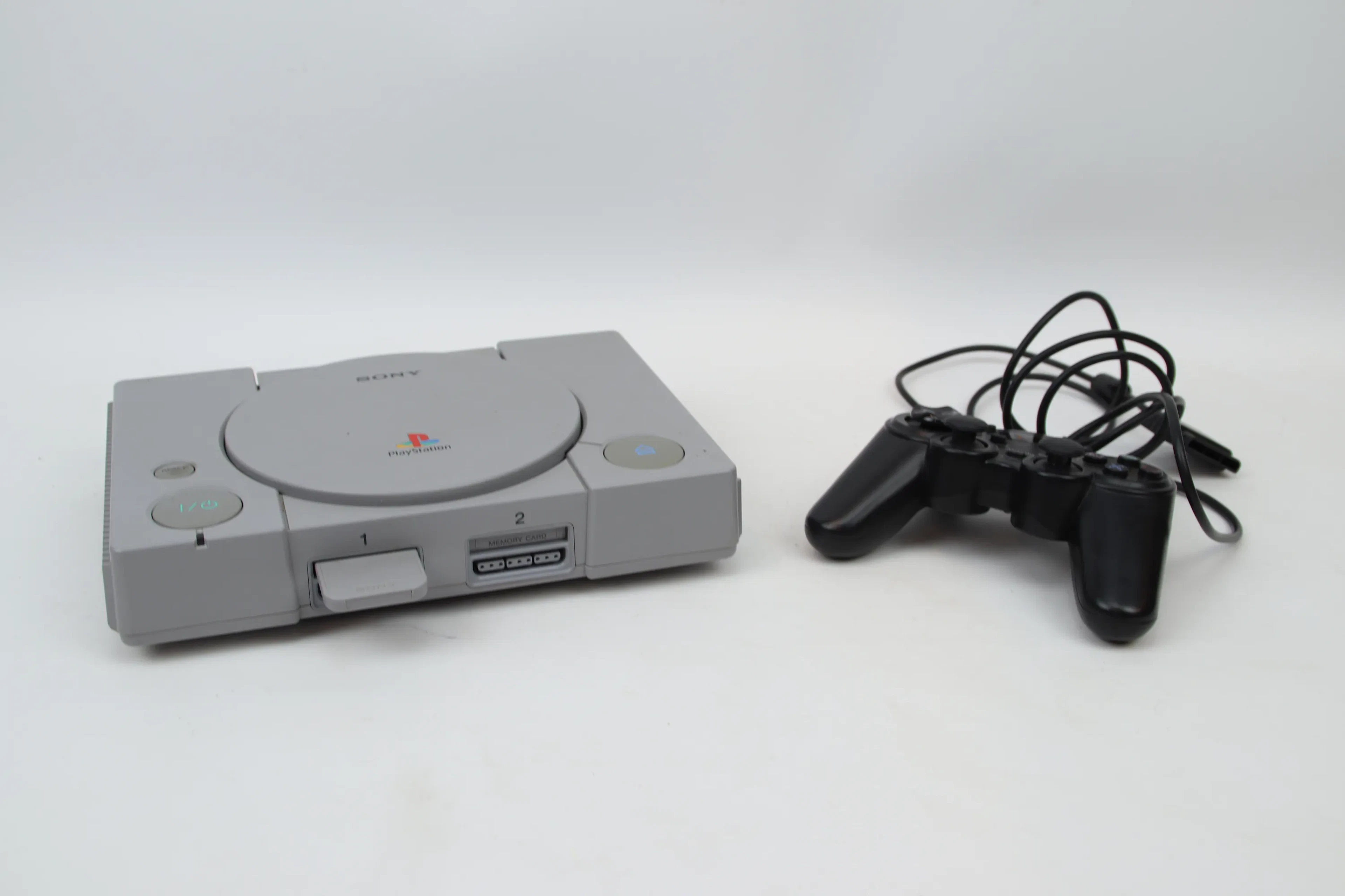 Game console, Sony Playstation, and controller.