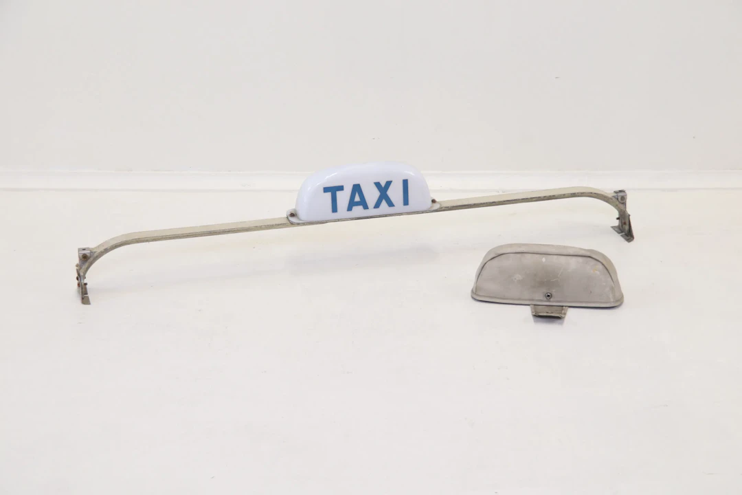 Taxi sign, metal/plastic.