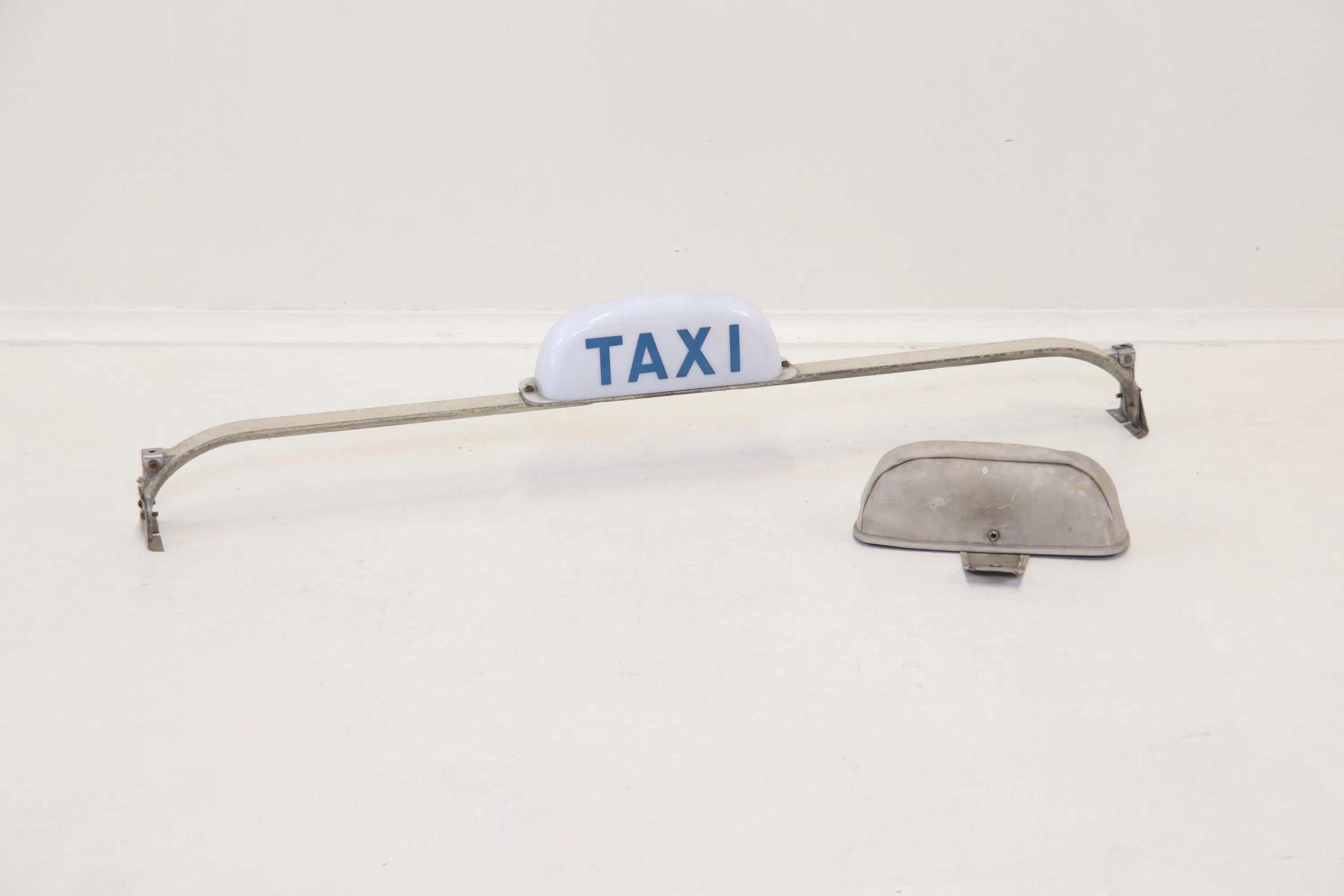 Taxi sign, metal/plastic.