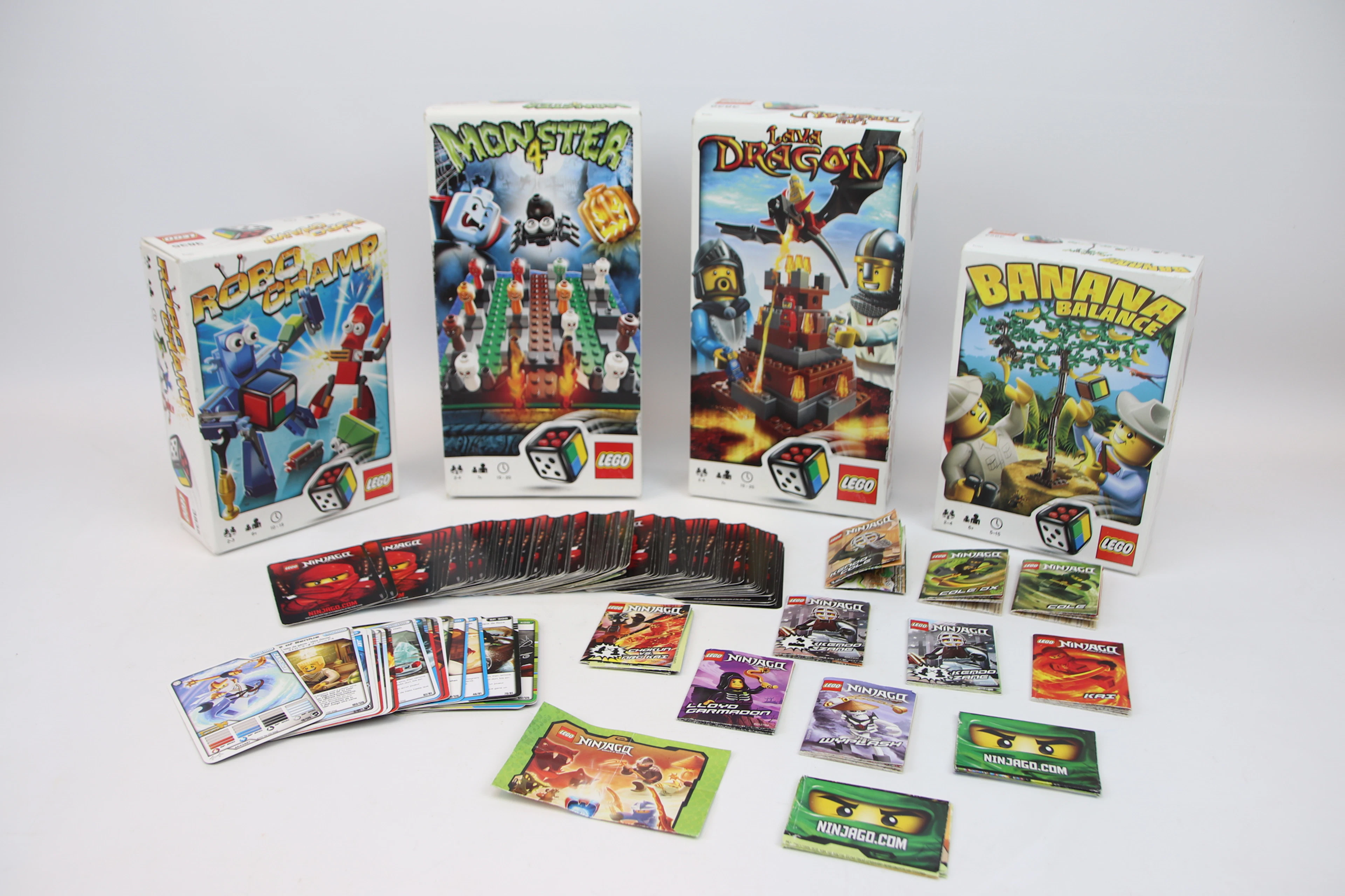 Juegos LEGO, incluyendo Monster 4 y Lava Dragon, así como cartas de Ninjago y más.