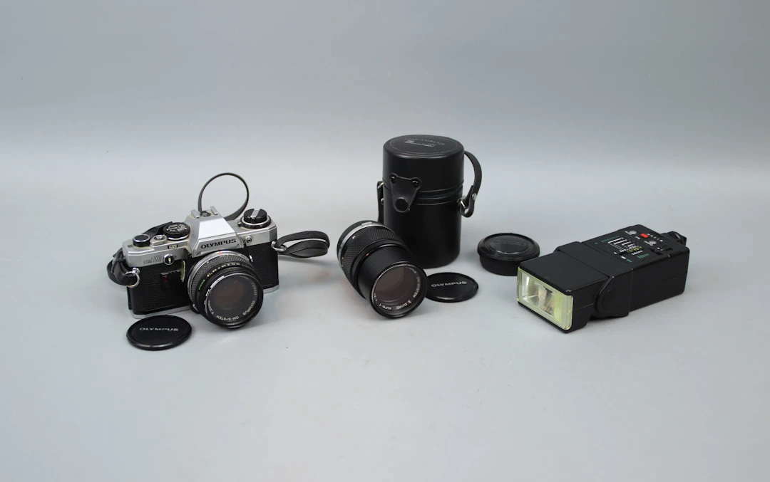 Camera, Olympus OM10, and accessories.