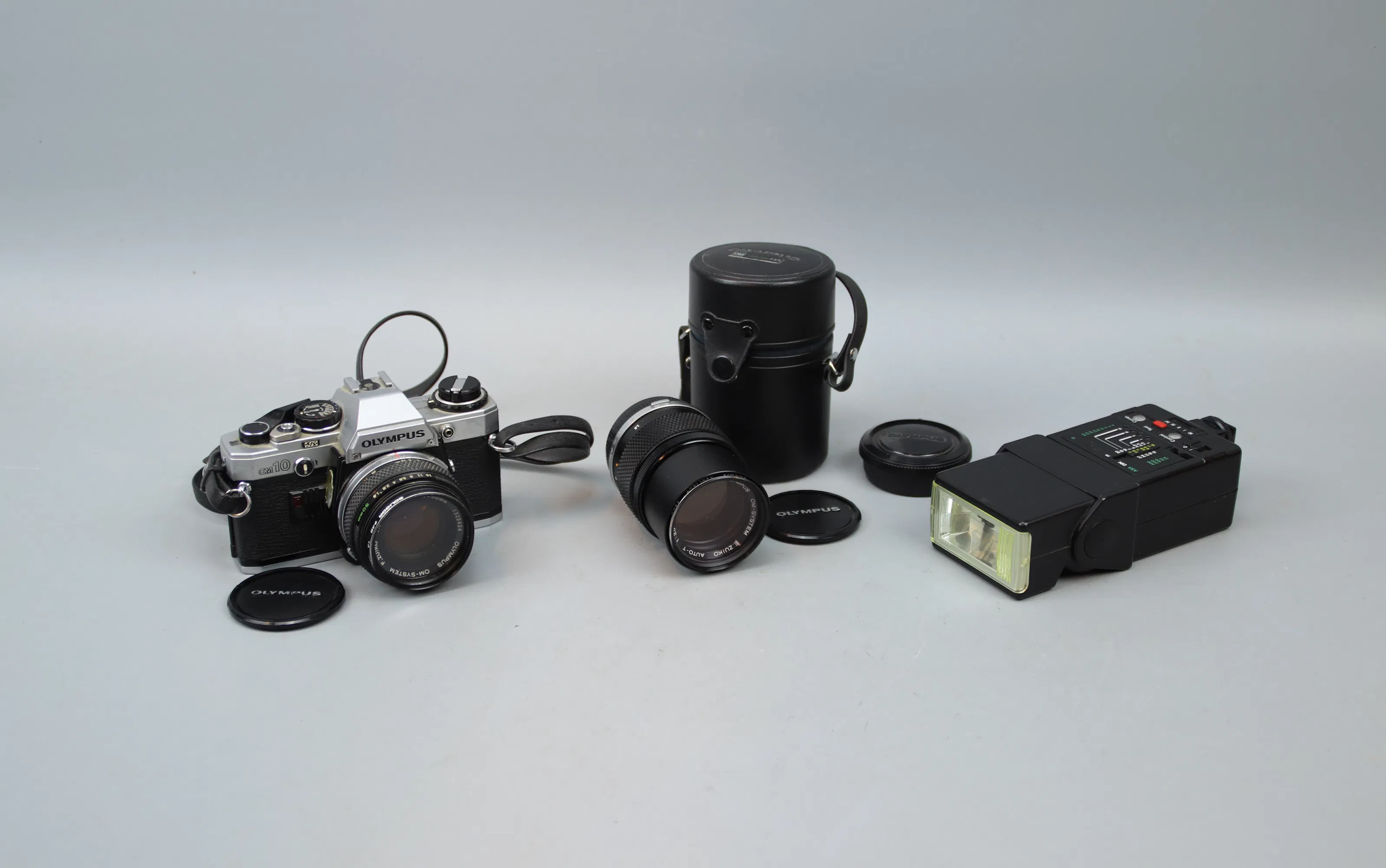 Camera, Olympus OM10, and accessories.