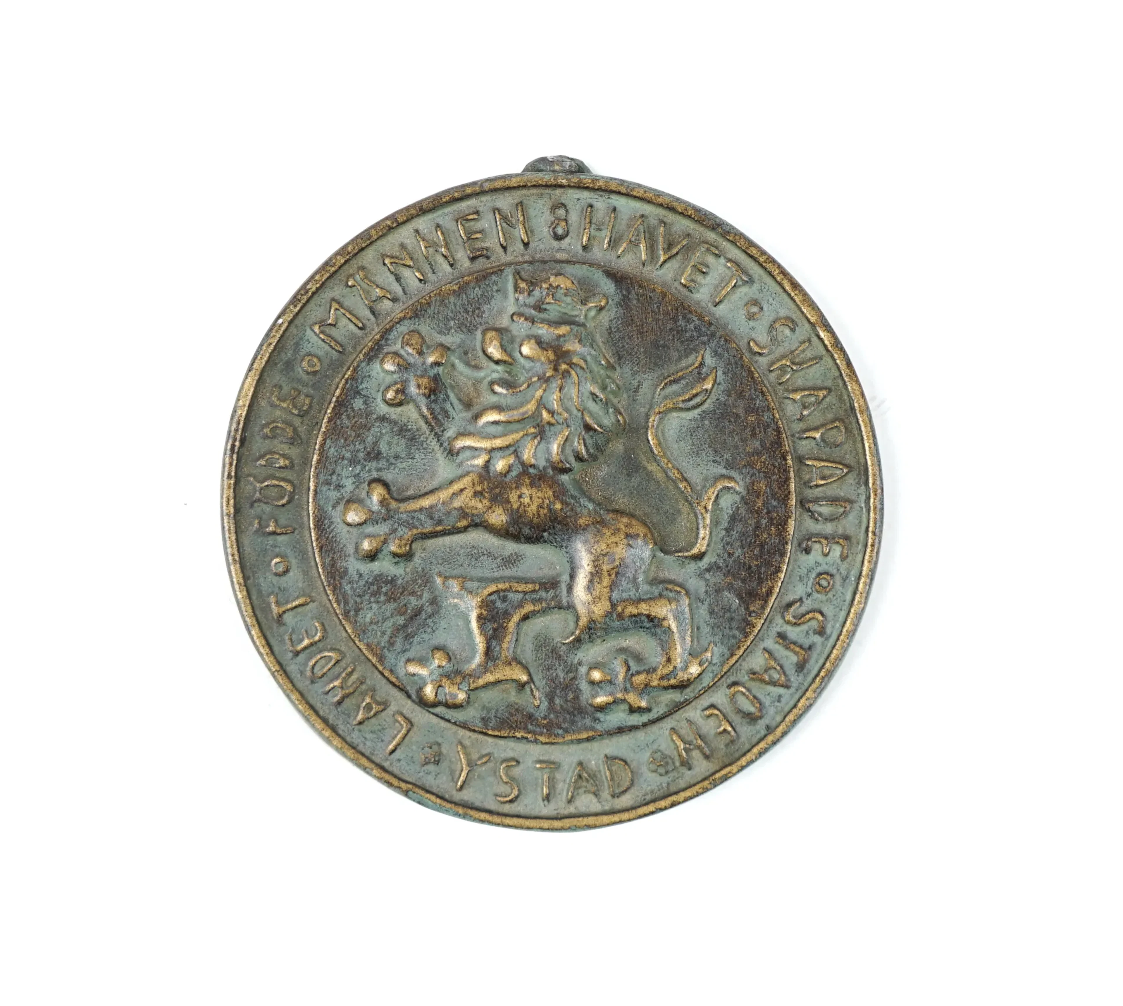 Medalla, ''La tierra dio origen a hombres-El mar creó la ciudad-Ystad'', bronce