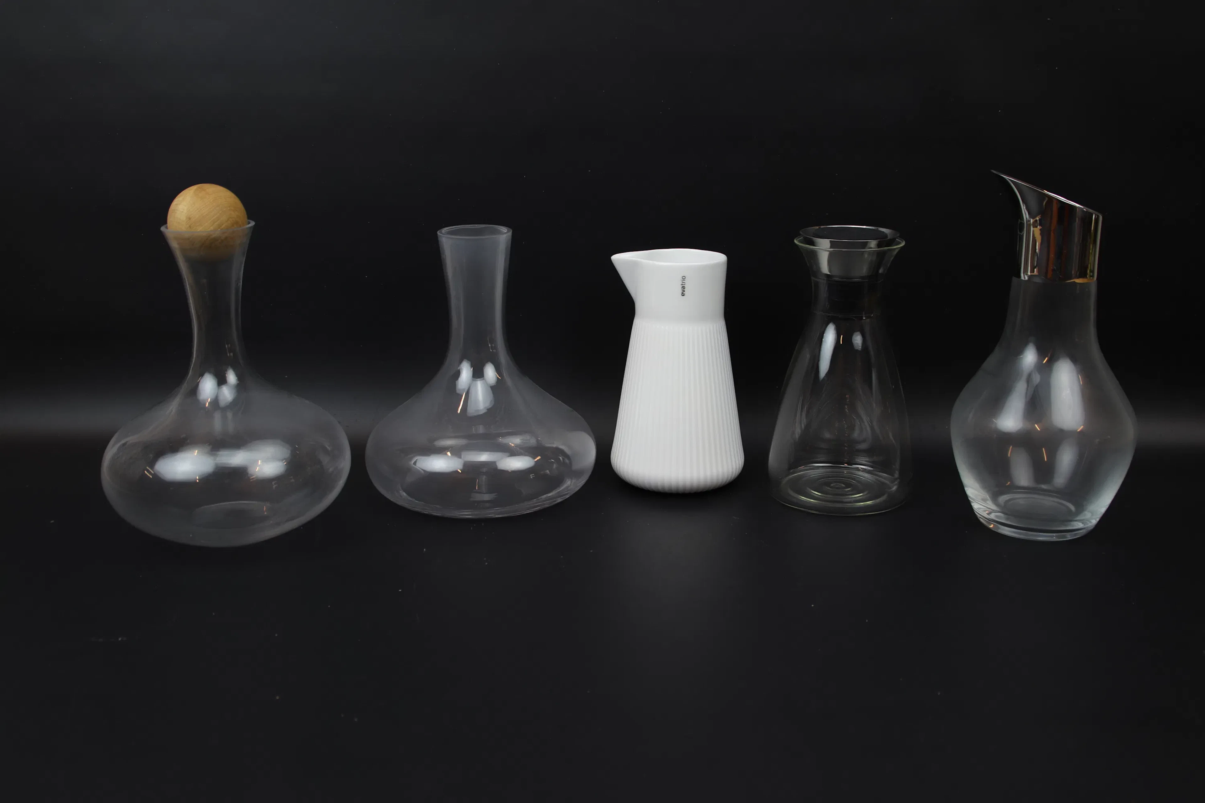 Decanters, 5 pcs, glass/ceramic/metal, including Georg Jensen.