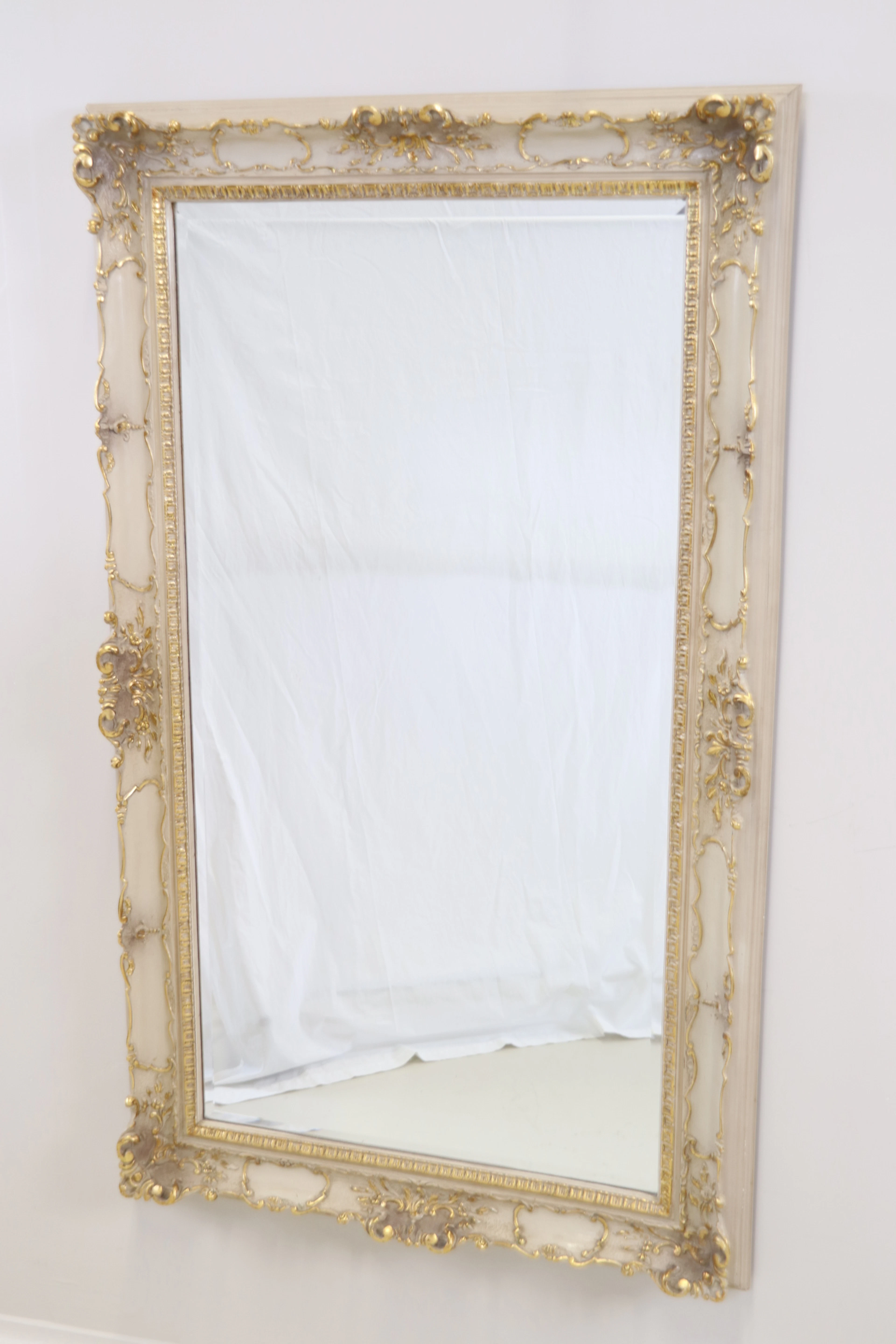 Mirror, painted wood, partly gilded, faceted glass, rococo style