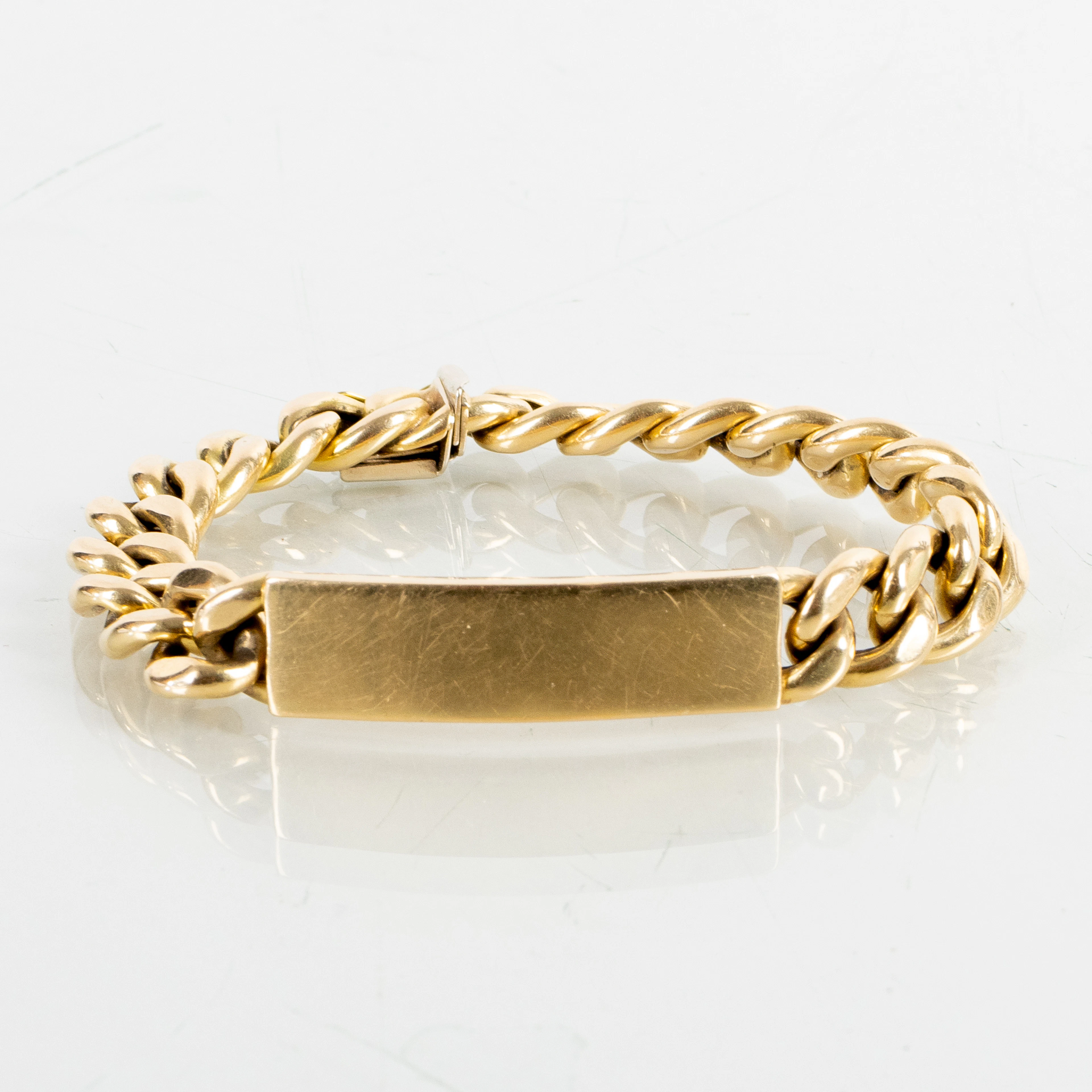 BRACCIALE, oro 18 carati, con placca, peso circa 36,4 g