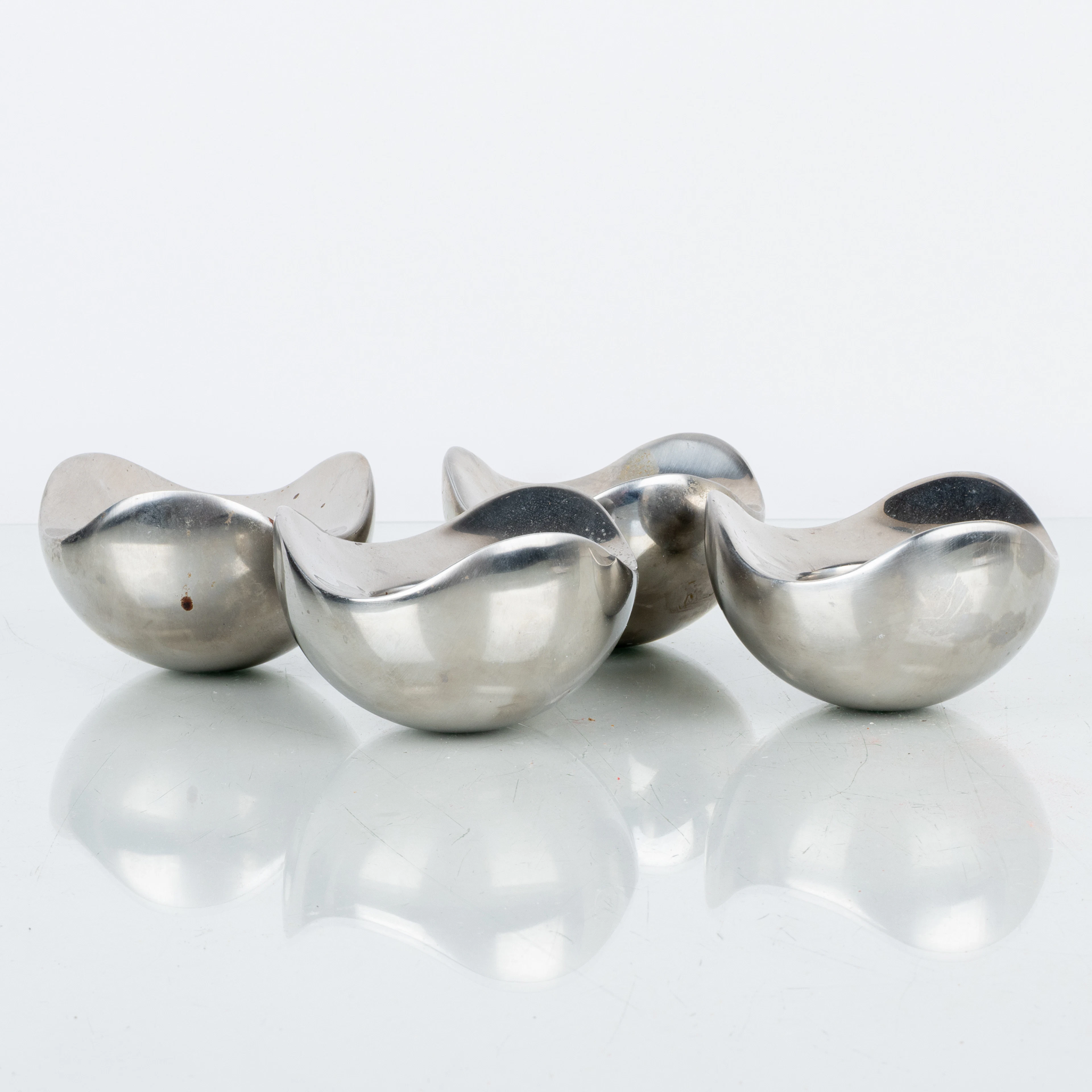 HELLE DAMKJÆR, 4 candelabros, acero inoxidable, "Bloom", Georg Jensen, Dinamarca