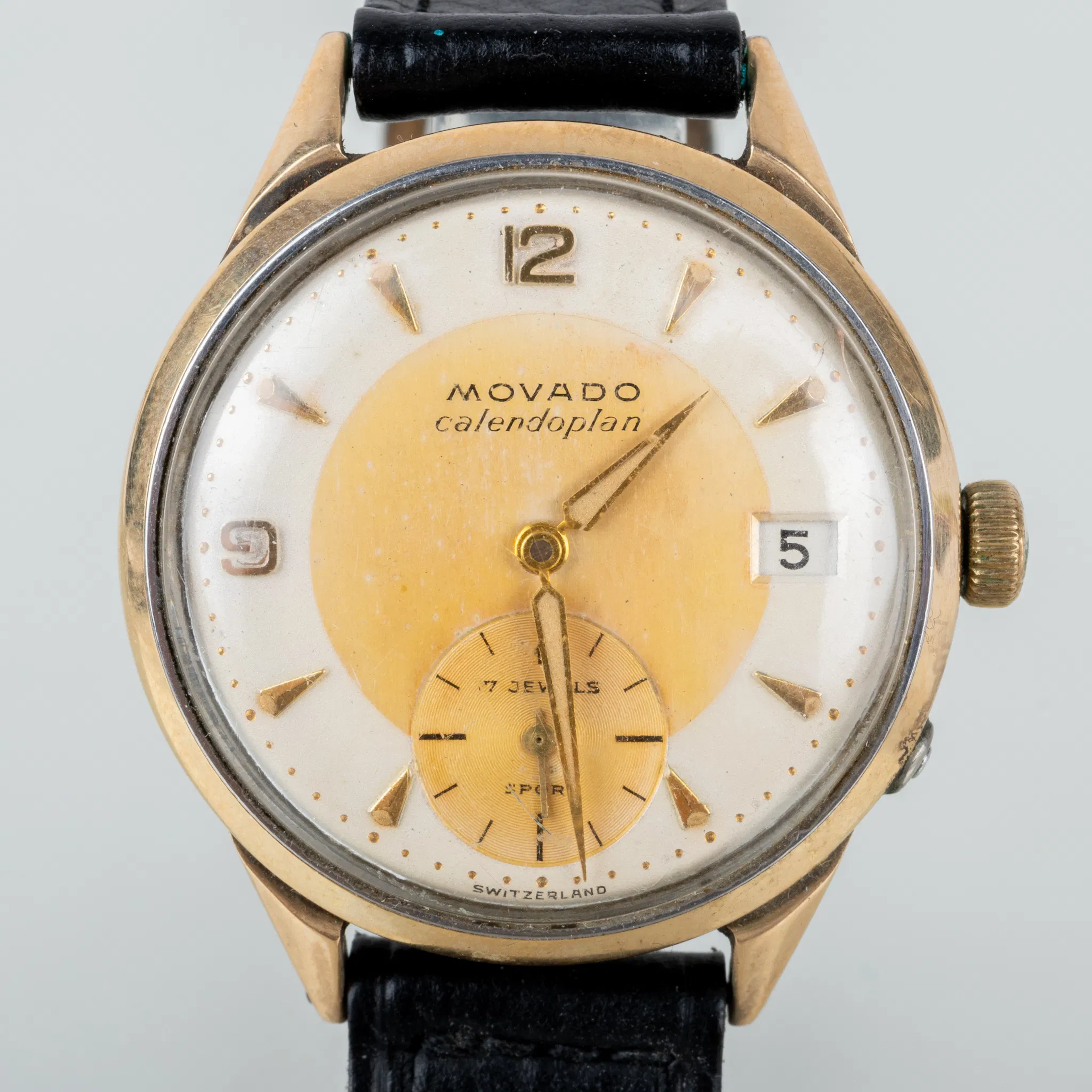 RELOJ DE PULSERA DE HOMBRE, Movado, Calendoplan, oro sobre acero, mediados del siglo XX