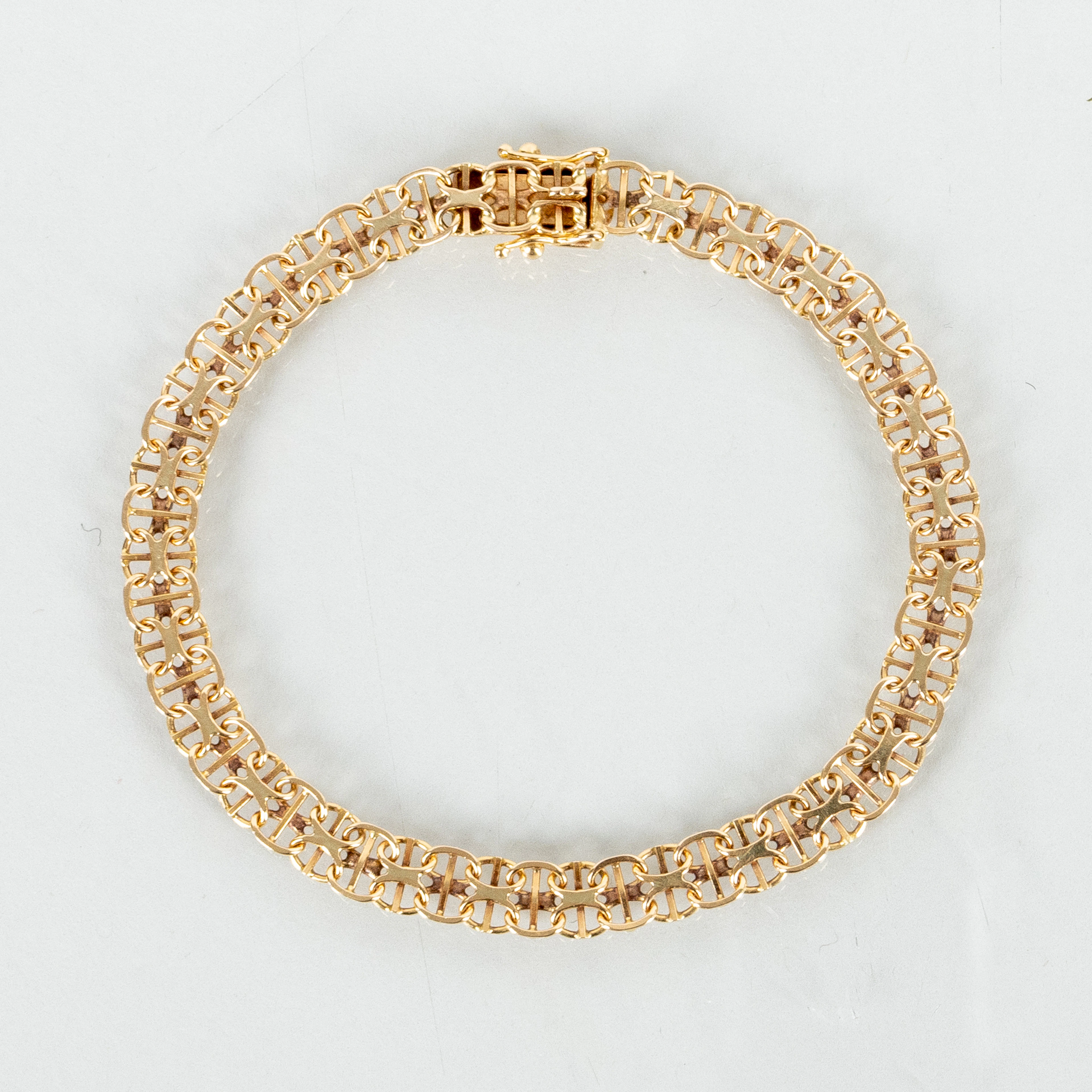BRACCIALE, oro 18 carati, maglia a X, peso circa 7 g
