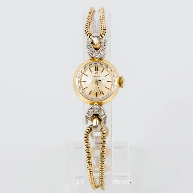 RELOJ DE MUJER, Omega, oro de 18 quilates, con diamantes tallado brillante, mediados del siglo XX