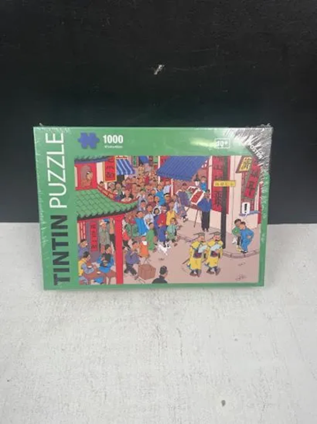 TINTIN (Hergé) - Puzzle 1000 pièces : Les rues de Shanghai / - Lot 238