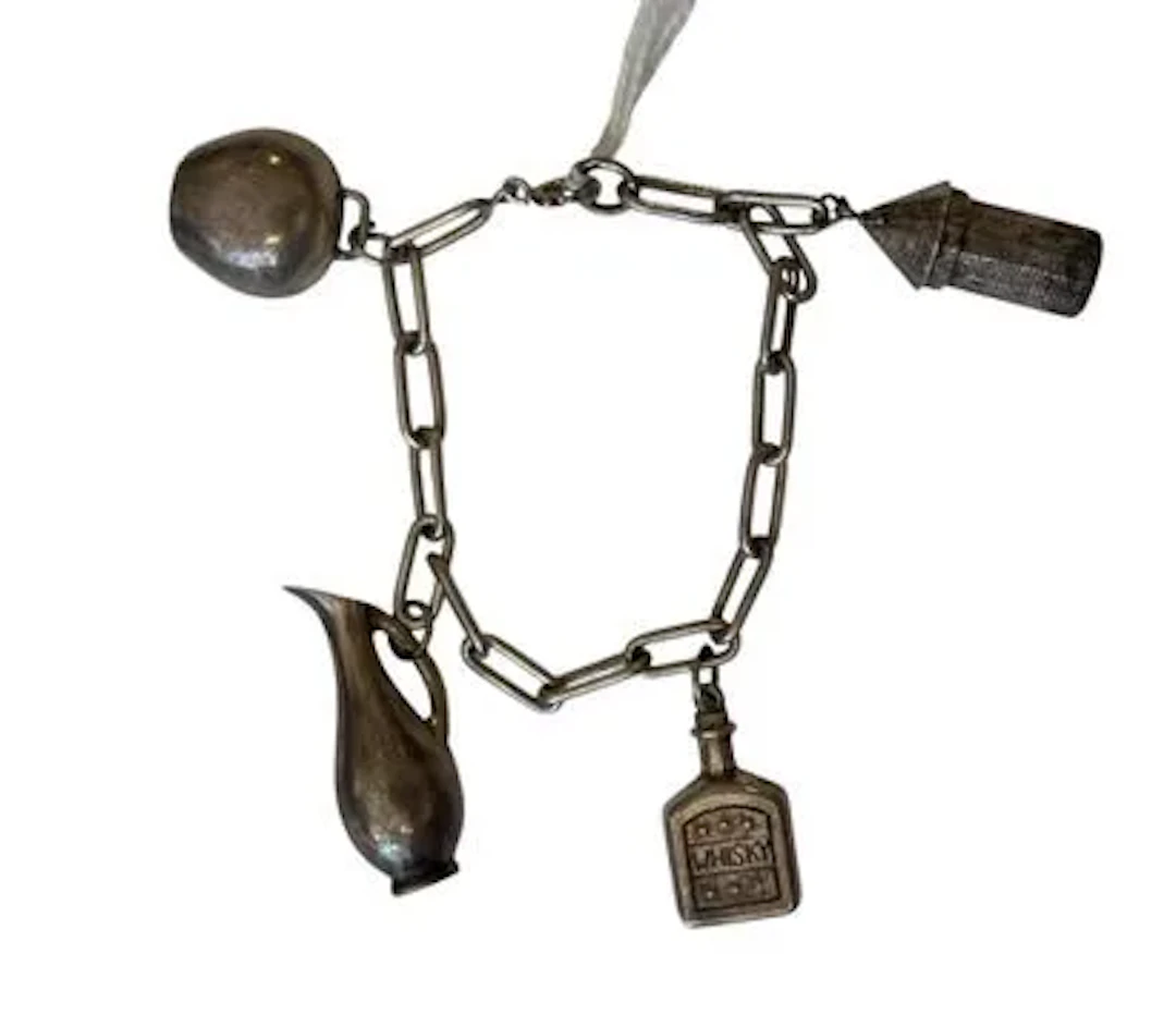 SILVER CHARMS BRACELET - Lot 157