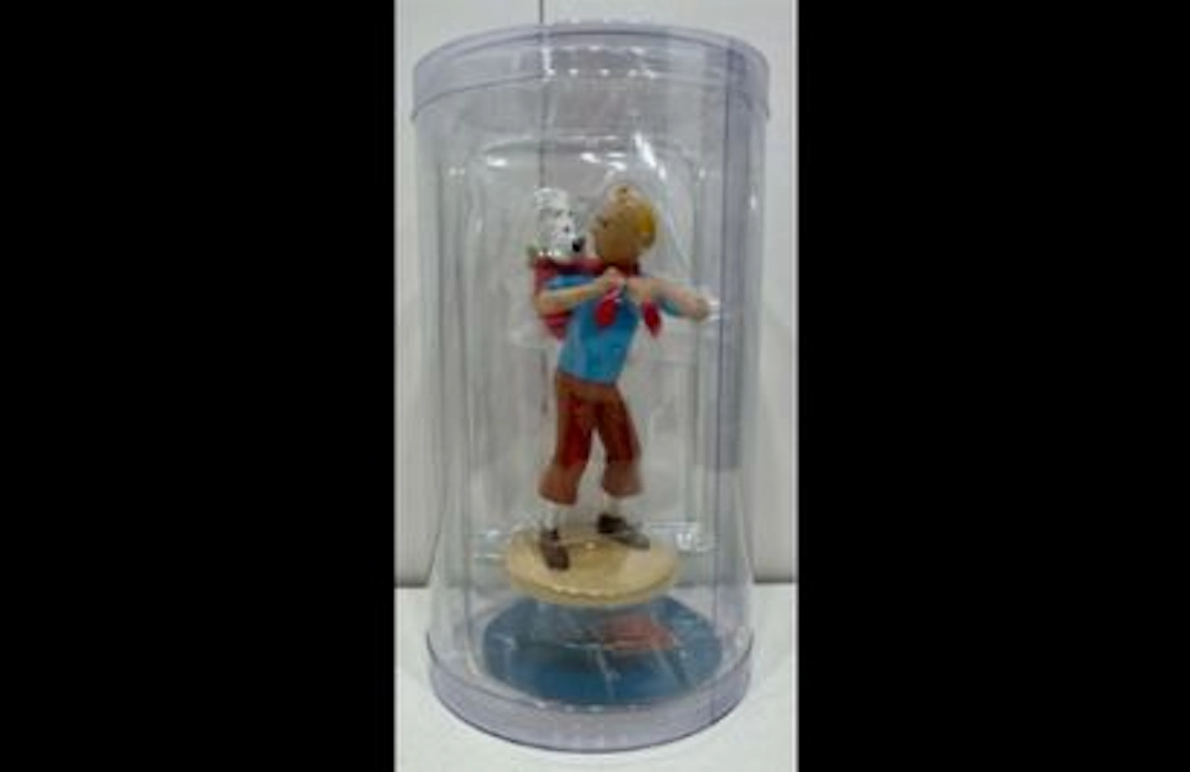 Figurine Tintin portant Milou Le Temple du Soleil 12 cm - Lot 146