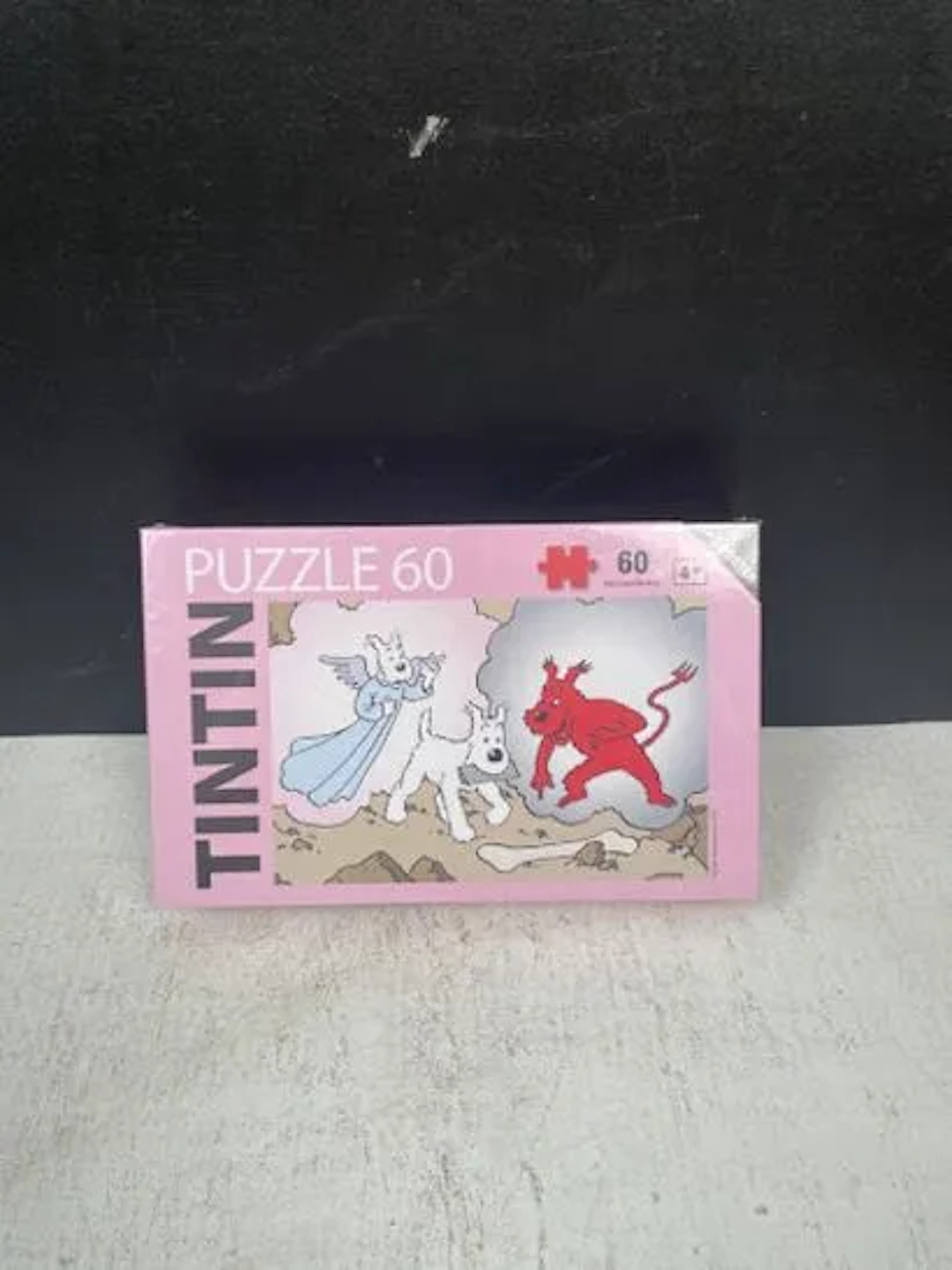 TINTIN (Hergé) - 60-piece puzzle: Snowy, torn between angel - Lot 233