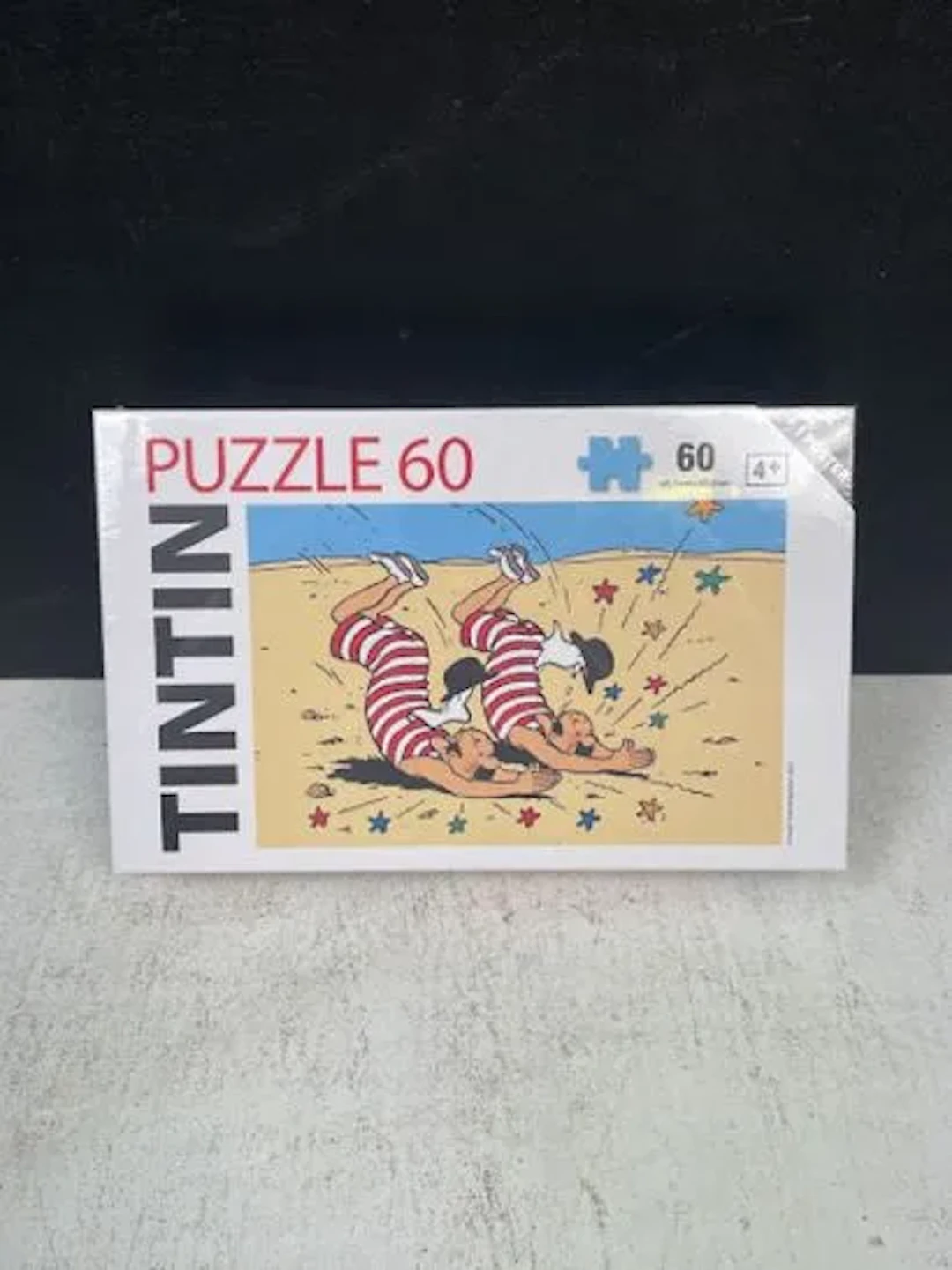 TINTIN (Hergé) - 60-piece puzzle: Thomson and Thompson at th - Lot 236