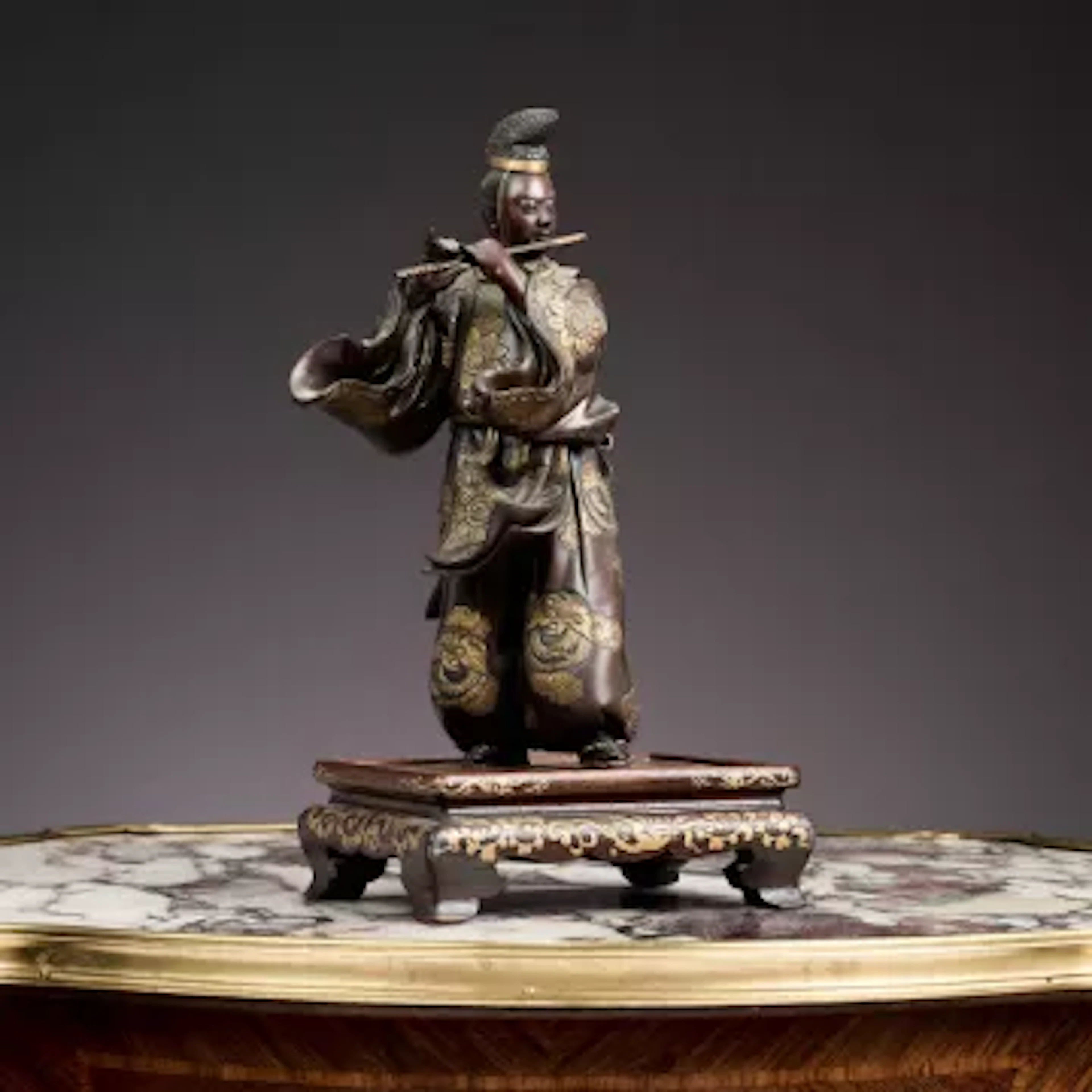 MIYAO EISUKE COMPANY OF YOKOHAMA: A BRONZE FIGURE OF A FLUTE PLAYER