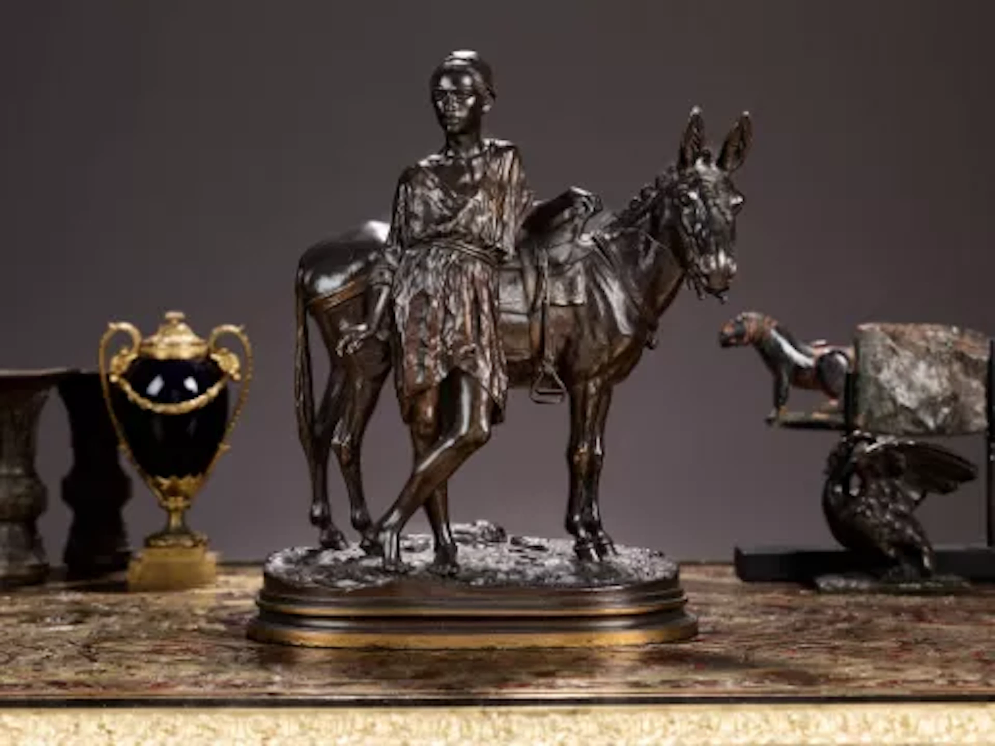 ALFRED DUBUCAND (FRENCH, 1828-1924): A BRONZE FIGURE OF A BOY WITH DONKEY
