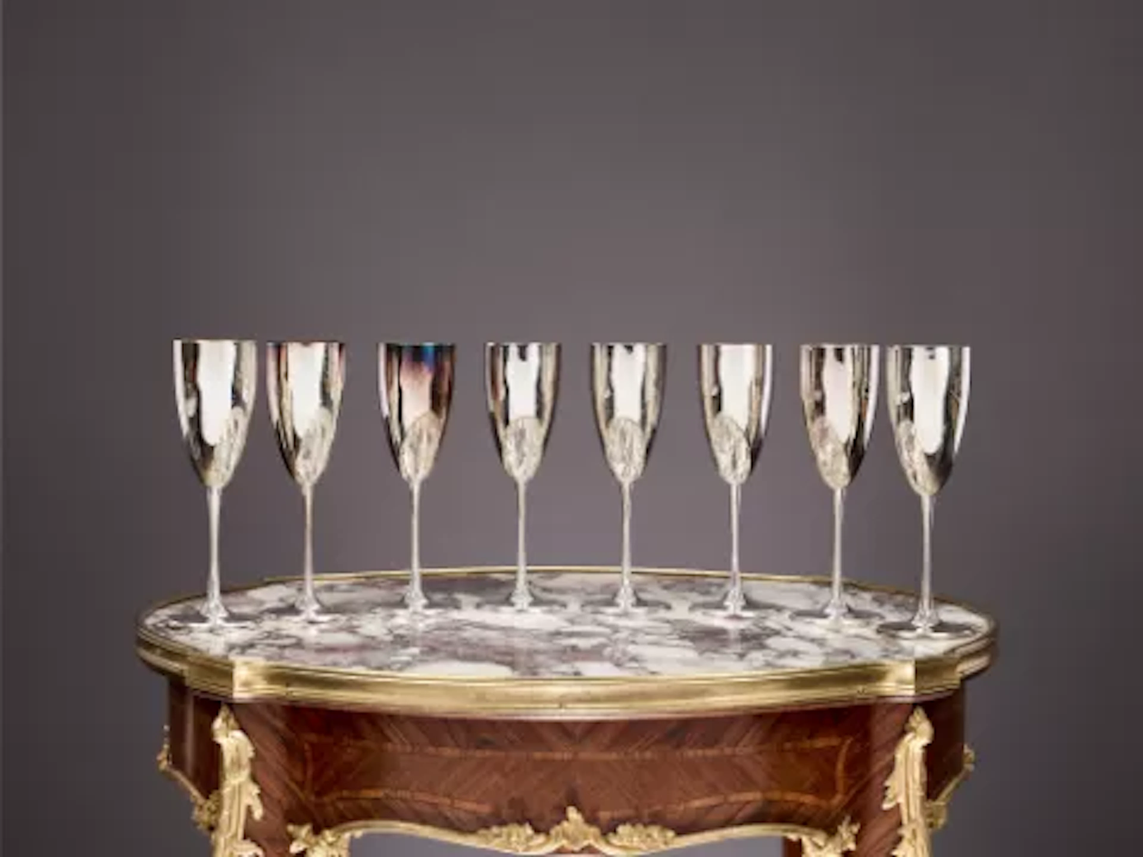 A SET OF EIGHT STERLING SILVER CHAMPAGNE FLUTES, ITALIAN