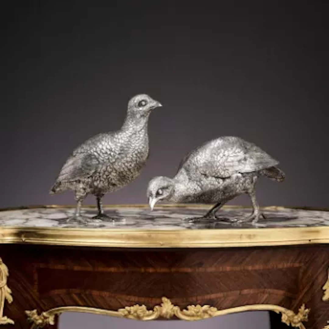 A PAIR OF STERLING SILVER MODELS OF A PARTRIDGES