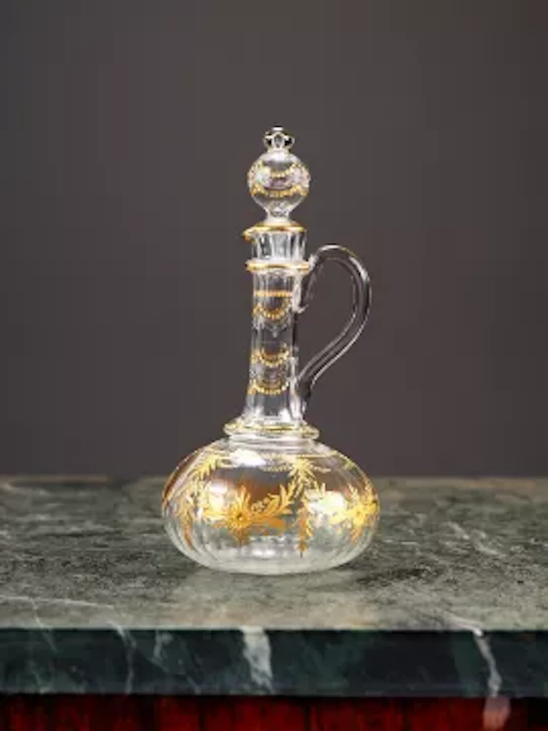 A LATE 19TH / EARLY 20TH CENTURY GILDED GLASS CLARET JUG / DECANTER