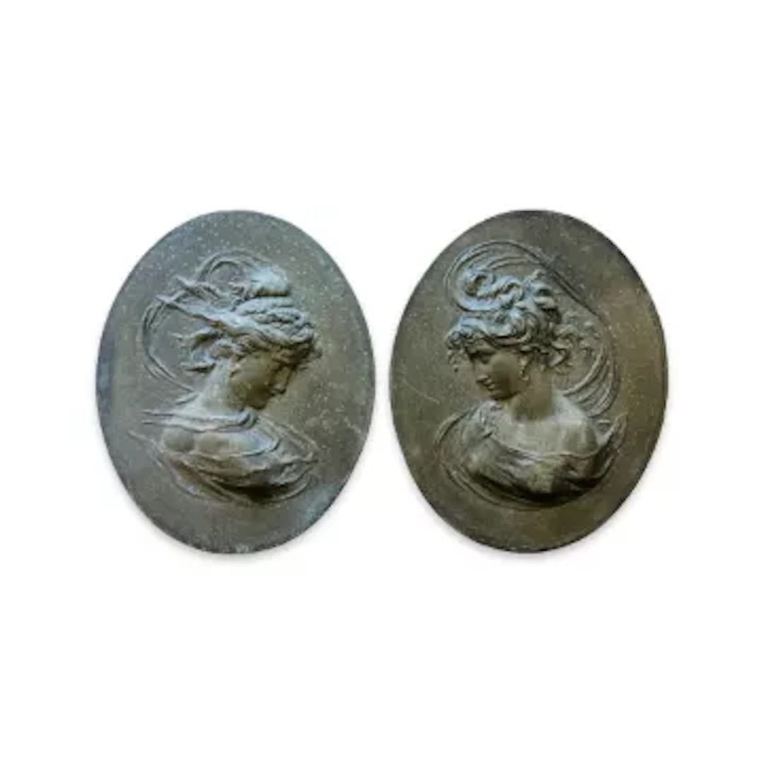 A PAIR OF ART NOUVEAU STYLE CAST IRON RELIEFS OF MAIDENS