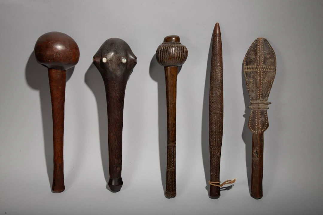Club with a head inlaid with mother-of-pearl discs. Rennell Islands