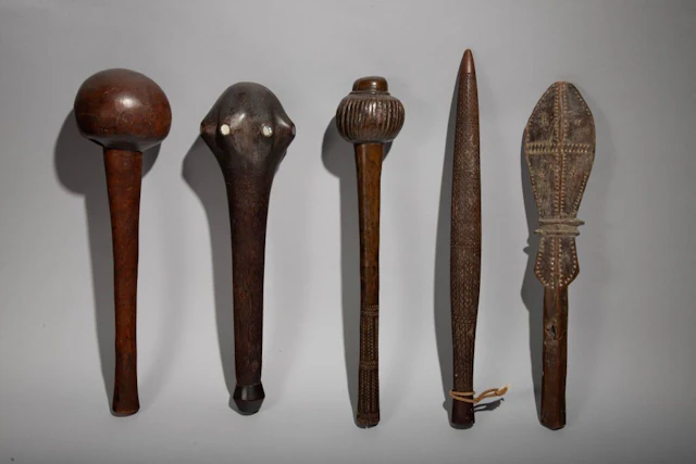 Club with a head inlaid with mother-of-pearl discs. Rennell Islands