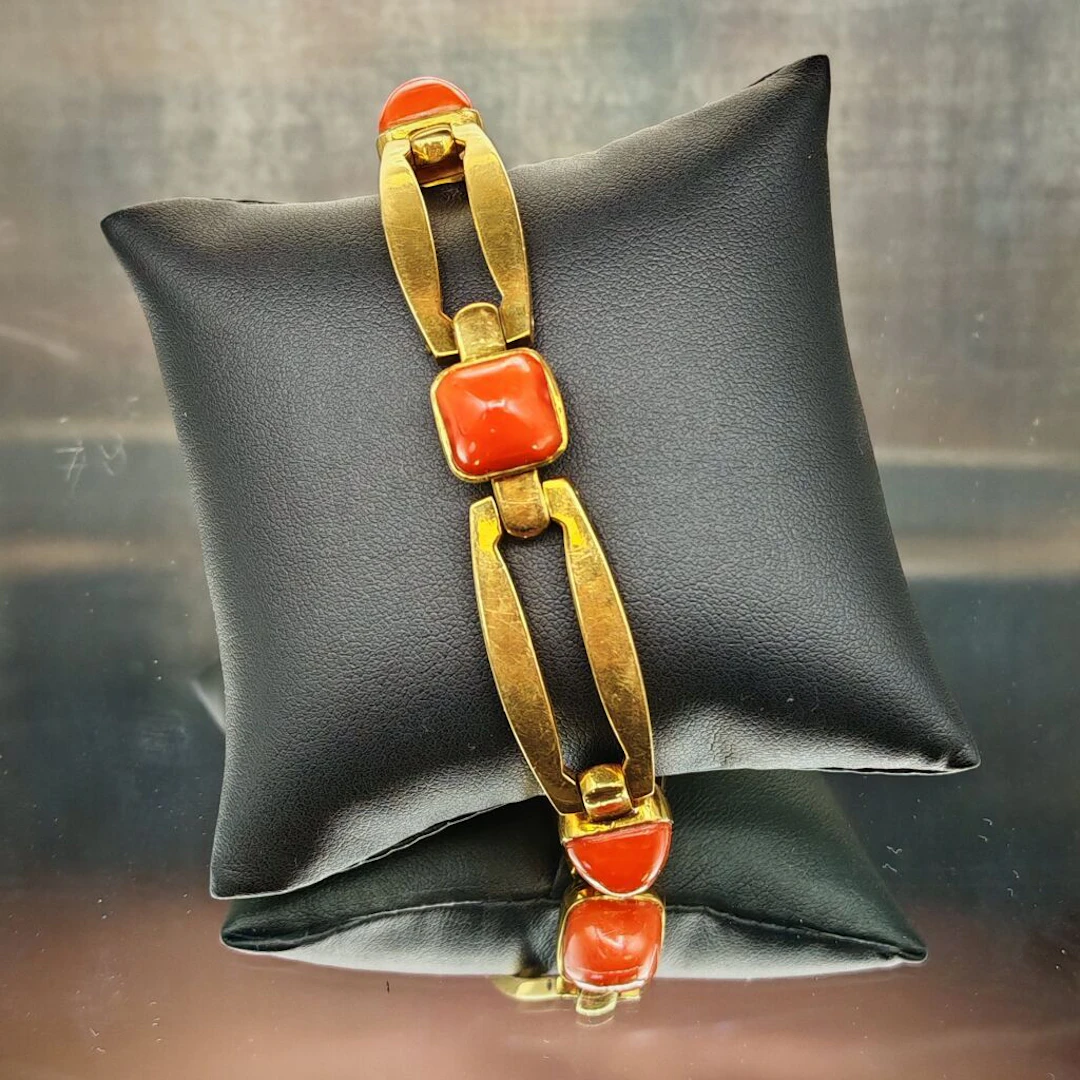 750‰ yellow gold bracelet with articulated oblong links interspersed