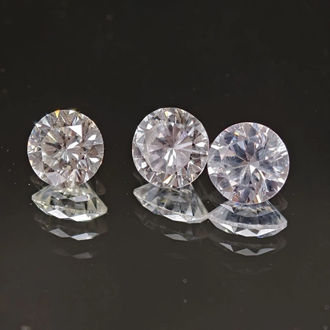 Set of two modern-cut diamonds: - one weighing 0.59 ct, diameter:
