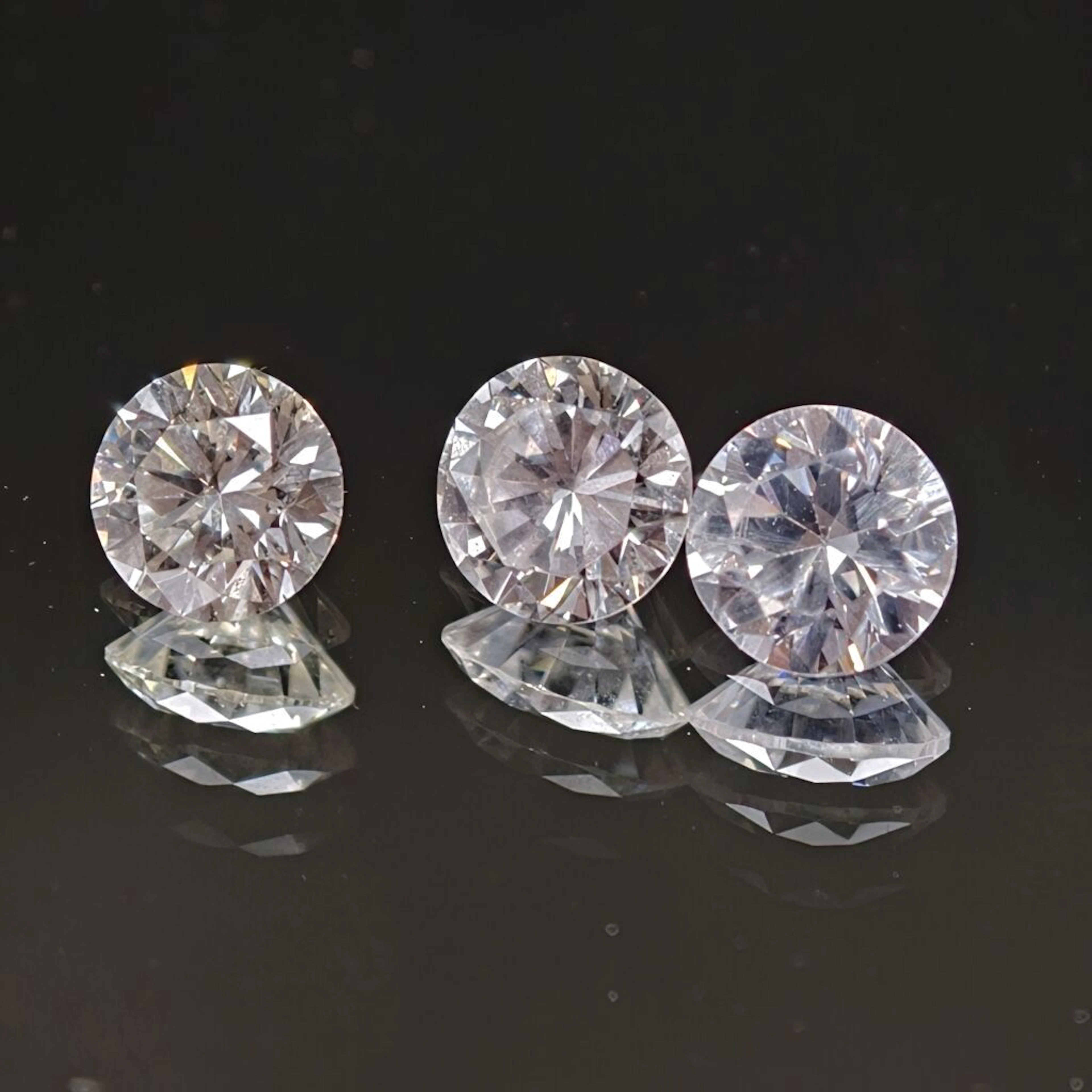 Set of two modern-cut diamonds: - one weighing 0.59 ct, diameter: