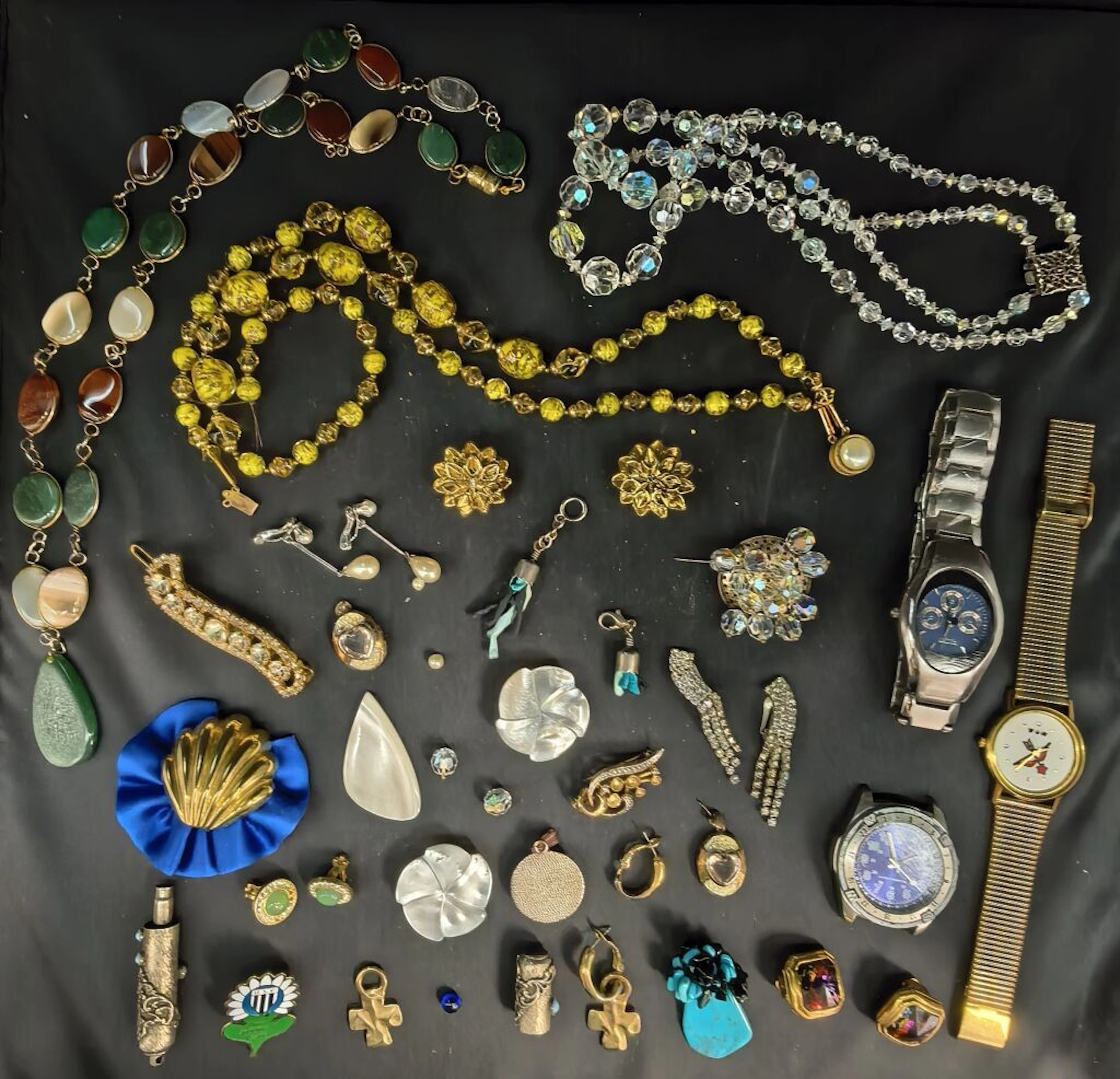 A set of costume jewelry, bordering on endearingly comical, including