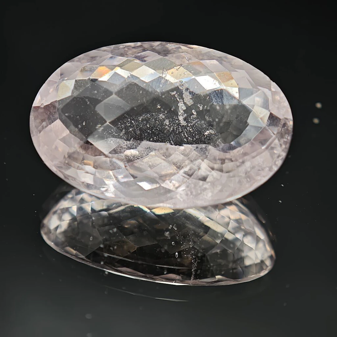 Oval-shaped morganite, briolette-cut at the base, weighing 64.48 carats.
