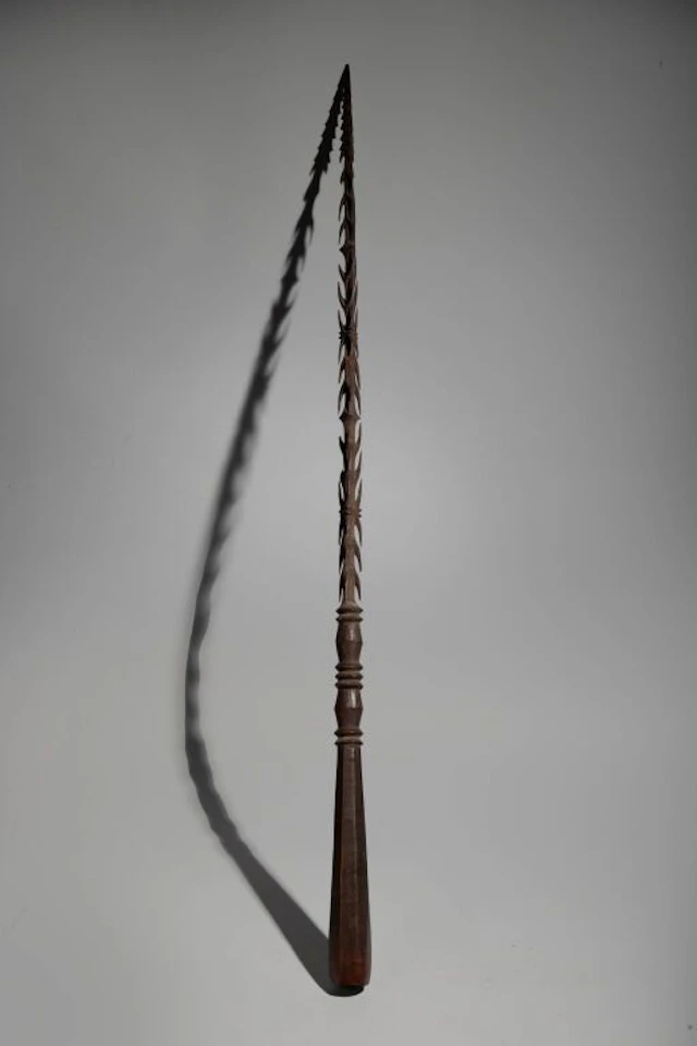 A rare hand weapon, entirely and delicately carved from a solid block